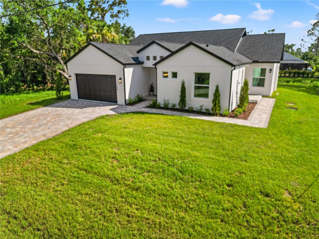 Photo of 1289 Oregon Lane, North Port, FL 34286 (MLS # O6334434)