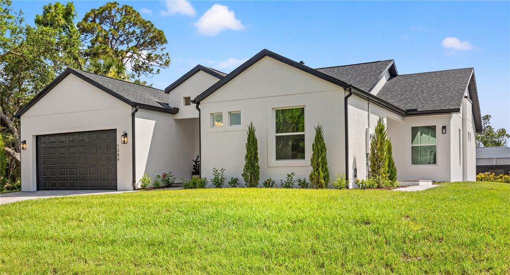 Photo of 1289 Oregon Lane, North Port, FL 34286 (MLS # O6334434)