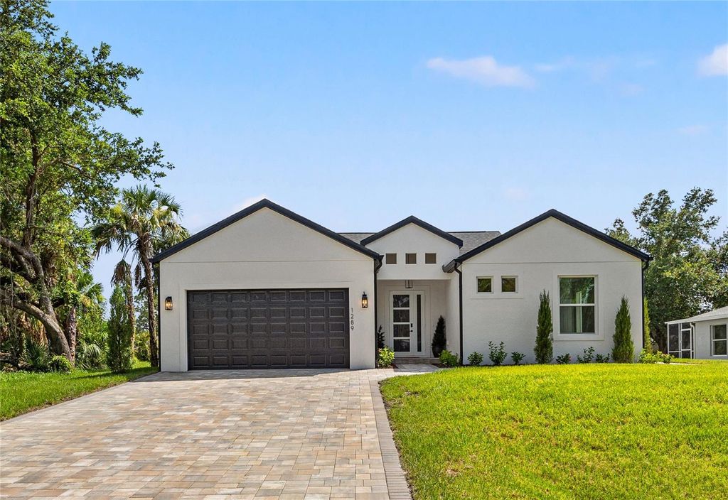 Photo of 1289 Oregon Lane, North Port, FL 34286 (MLS # O6334434)