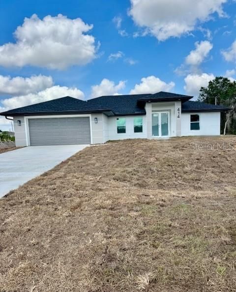 Photo of 414 Piper Avenue, Lehigh Acres, FL 33974 (MLS # A4658245)