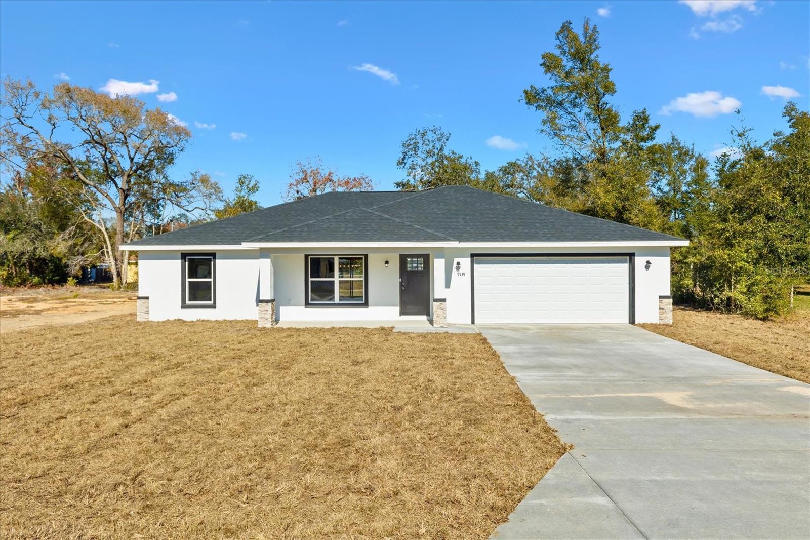 NEW CONSTRUCTION MOVE-IN READY!! Located in the family-friendly neighborhood of Sunny Skies this 3BR/2BA is within arm's length of THE VILLAGES, Ocala, shopping, dining, schools, and much more. Situated on an OVERSIZED .24 acre lot this home offers plenty of space to stretch out arms without feeling stacked. Comprised of a total of 1,710+/- sqft under air this home features a split floor plan with vaulted ceilings, LVP flooring, an inside laundry room, a 2-car garage, and a patio. The kitchen features granite countertops, stainless steel appliances, a kitchen island, and soft-close cabinetry. The master bedroom is enhanced with a walk-in closet, and an ensuite including his/hers sinks, and a private lavatory and a seamless walk-in shower. The spare bedrooms are spacious with a shared hall bath and linen closet. With plenty of space for your family, you'll love everything that this home has to offer with a great neighborhood. Move-in Costs are First month's rent ($2,100) and Security Deposit ($2,100). No Smoking. Lawn care included. Photos are of a Model home.