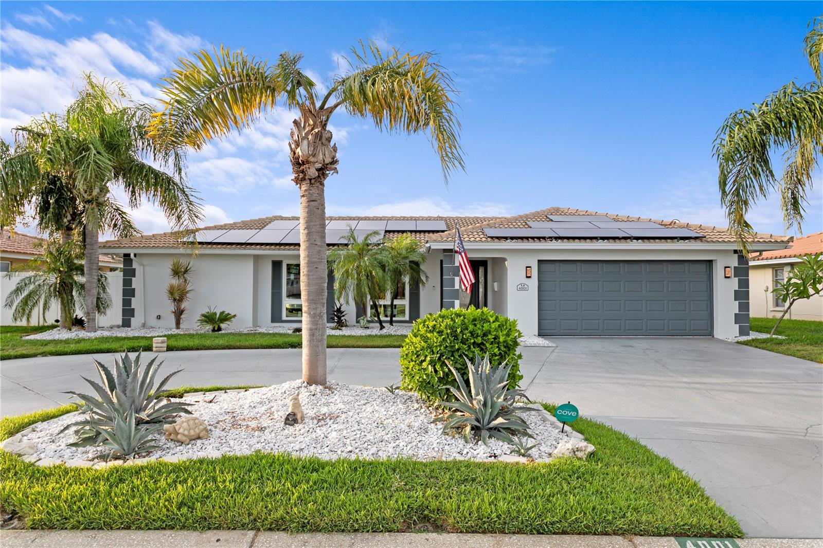 Enjoy peace of mind and luxury in this no water intrusion, fully rebuilt 3-bedroom, 2-bath waterfront home. Every inch of the interior has been redesigned and upgraded through a comprehensive renovation with over $300,000 in high-end upgrades, including premium materials, finishes, and modern systems. The open-concept layout flows seamlessly throughout, anchored by a stunning kitchen that was relocated and expanded into the former dining area. This chef-designed space features 100 percent custom cabinetry, natural stone countertops, and an expansive 11-foot island with built-in storage. Outfitted with Viking and Miele appliances, it includes a gas range, in-wall coffee machine, double ovens, dual dishwashers, fridge drawers (inside and out), a walk-in pantry, butler’s pantry, three sinks, pot filler, and a separate built-in freezer and fridge. Both bathrooms are fully renovated with designer finishes, including Toto bidet toilets, a rain shower in the primary suite, and elegant, high-end fixtures. Bedrooms feature custom Elfa closet systems for smart, sleek storage solutions. This home also features a complete electrical rewire, along with extensive upgrades to all major systems: New switches, fixtures, and lighting throughout, Cast iron sewer lines replaced with PVC, Copper plumbing upgraded to PEX, Hurricane-rated impact windows and sliding glass doors, All-new attic and wall insulation, ceiling fans, and HVAC system, Solar panels significantly reduce energy costs, 24/7 monitored security system with cameras, electric blinds, and smart tech features. Outdoors, enjoy resort-style living with a heated pool, refinished tile, and new filtration system. The outdoor kitchen is fully equipped with a wood-burning pizza oven, grill, griddle, and sink. The property also features parasite-resistant sod, a turf-lined dog run, composite dock with 25,000-pound boat lift, and lush, low-maintenance landscaping. This home blends waterfront elegance, modern comfort, and total peace of mind fully renovated, move-in ready, and built to the highest standards
