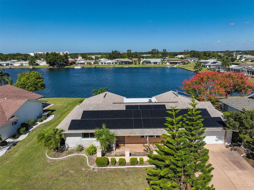 HUGE PRICE IMPROVEMENT!  SELLER ALSO OFFERING $10,000 CREDIT AT CLOSING TOWARD REPAINTING INSIDE AND OUT AND WALLPAPER REMOVAL. Experience the serenity of sunsets over Simmons Lake within the vibrant 55+ community of Sun City Center. This home offers an enchanting view of the boatable lake. It also includes a new roof, solar panels, and an insulated room adjacent to the spacious two-car garage, equipped with HVAC, making it versatile as an art studio, office, or even a third bedroom. Additionally, there's an all-season room, perfect for savoring fall and winter days while enjoying the lake views, thanks to its tile flooring—a delightful spot for your morning coffee or an evening cocktail.

The main bedroom en-suite is a highlight, featuring a bay window that frames a stunning view of the lake, complemented by new carpeting. With a bit of tender loving care, you can personalize this home and make it your own.

NO HOA. BUYER PAYS ONE TIME FEE TO SCC CA OF $3000 at closing, THEN $324 PER PERSON PER YEAR. What a deal! COME HAVE FUN UNDER OUR SUN at Sun City Center w/ Active Adult living & state-of-the-art fitness center, indoor Olympic lap pool, resistance pool & outdoor pool. Softball, Pickleball, tennis, Arts/crafts, model train, woodworking, lawn bowling, dancing & 150+ clubs & activities. Club Renaissance & 72 holes of golf under separate optional membership available! Conveniently located to everyday living & Tampa, Sarasota, St. Petersburg, Tampa International Airport, sporting events, beaches, theaters, shopping, dining & more!