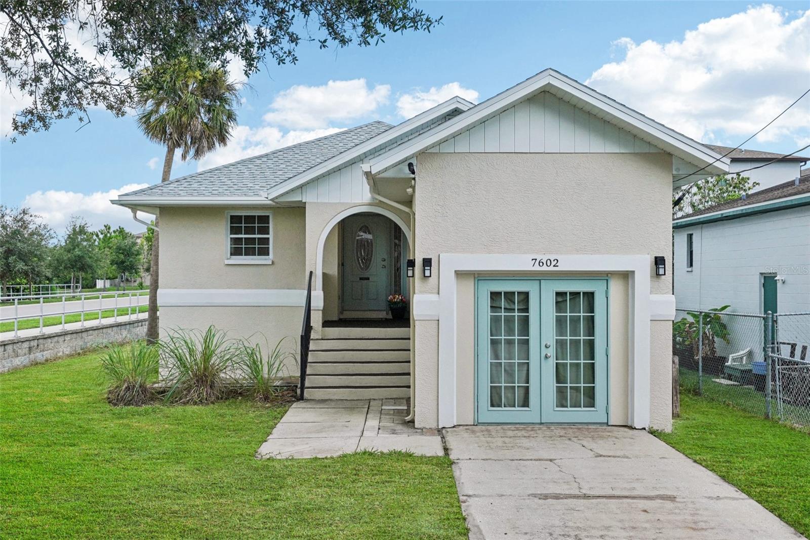 This charming three-bedroom, two-bathroom home is ideally located in South Tampa, just MINUTES from MacDill Air Force Base. This thoughtfully updated home features HIGH ceilings, lots of natural light, a brand NEW ROOF (April 2025) and a NEW kitchen complete with Cambria counter top, stunning back splash, bright cabinet doors and brand new appliances. The interior offers fresh touches throughout, including a newly replaced dual sink bathroom vanity top, and a brand new washer and dryer (both May 2025). Stay cool with new ceiling fans (June 2025) and enjoy the comfort of impact windows. Step outside for a morning coffee on the covered front porch or entertain on the backyard deck (repainted April 2025). The primary bedrooms offers a walk-in closet and en-suite bathroom.
The exterior was freshly repainted in April 2025, the garage interior on 30 July 2025. New exterior lights have been installed in May 2025. New sod and new irritgation system will be installed first week August 2025 (first photo (grass) edited in anticipation of that), giving the yard a fresh, vibrant look. This charming home combines comfort, location, and updates that make everyday living easy - NO HOA - Enjoy the convenience of being close to popular restaurants, shopping, easy access to Selmon Express Way, Picnic Island park and its beach. Make this beauty your new home!