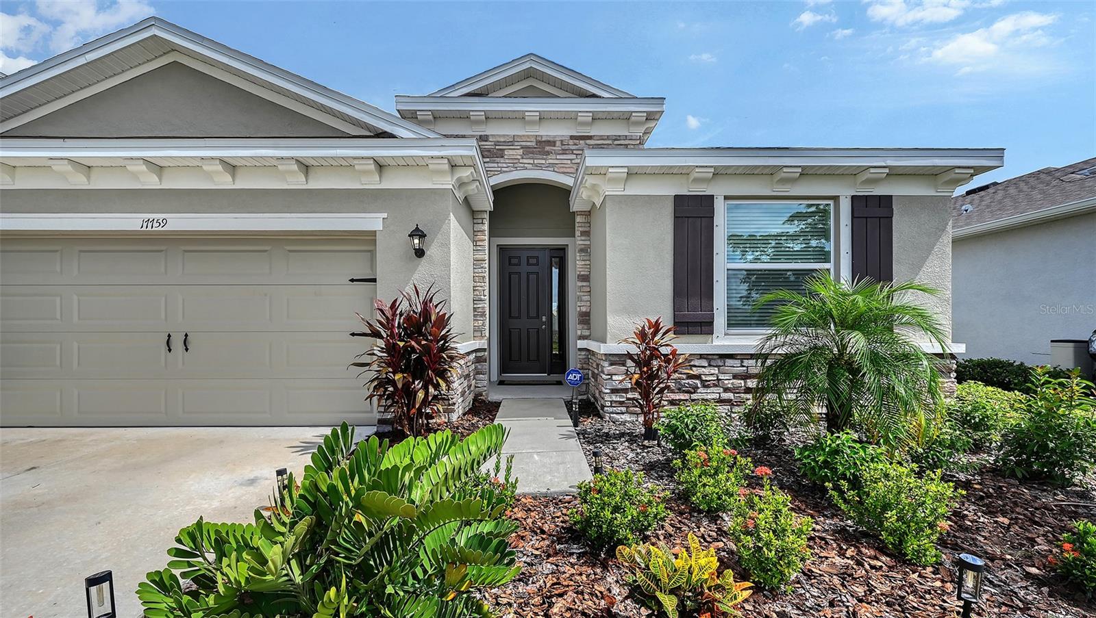 Welcome to this value priced and nicely appointed Lakewood Ranch home, located in Solera. With lovely water views, over 2,000 sq ft of living area and four bedrooms, flexibility and privacy are yours in this wonderful floorplan. Stylish landscaping and a stacked stone entry great you along with a full two car garage. The interior boasts tile flooring in the main living area, extra recessed can lights, open concept kitchen with granite countertops, and much more. The primary suite has a tray ceiling, walk-in closet, dial sinks and a soaking tub with walk-in shower. The extra bedrooms and powder bathroom add to the abundant sense of space. The fees in Solera include landscaping and irrigation for stress free living. Living in Solera at Lakewood Ranch means enjoying the best of Florida’s #1 master-planned community. This vibrant neighborhood offers resort-style amenities including a sparkling community pool, clubhouse, playground, and walking paths—all surrounded by beautifully landscaped grounds. Residents love the convenient location, just minutes from top-rated schools, shopping, dining, and the Gulf Coast’s world-class beaches. Lakewood Ranch itself is renowned for its thoughtfully designed villages, active lifestyle, and year-round community events. From farmers markets and outdoor concerts to golf, pickleball, and nature preserves, there’s something here for everyone. With easy access to I-75, commuting to Sarasota, Tampa, or St. Pete is a breeze, while still coming home to the peace and charm of Solera. Solera at Lakewood Ranch isn’t just a place to live—it’s a place to thrive, where neighbors become friends and every day feels like vacation.