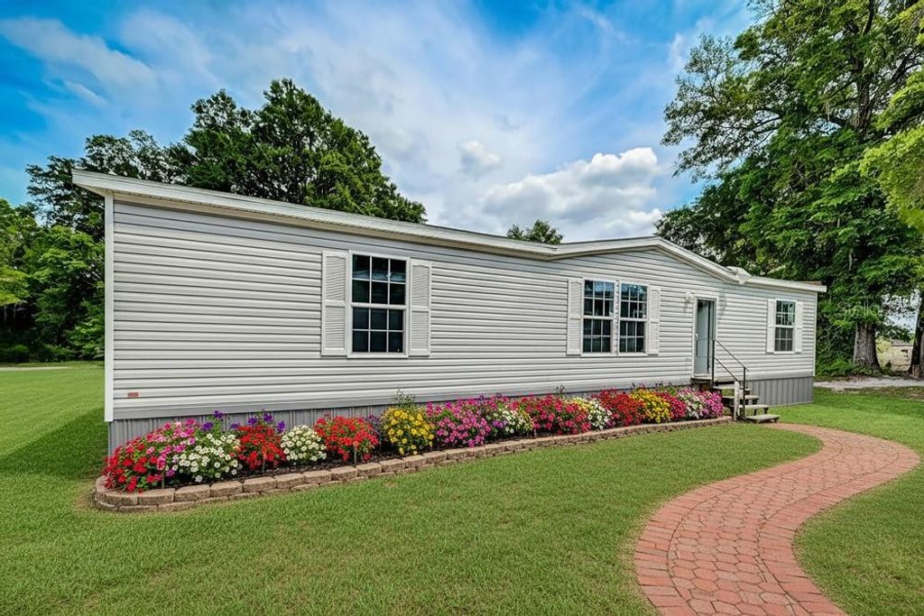 Photo of 3176 NW 74th Terrace, Okeechobee, FL 34972 (MLS # O6401382)