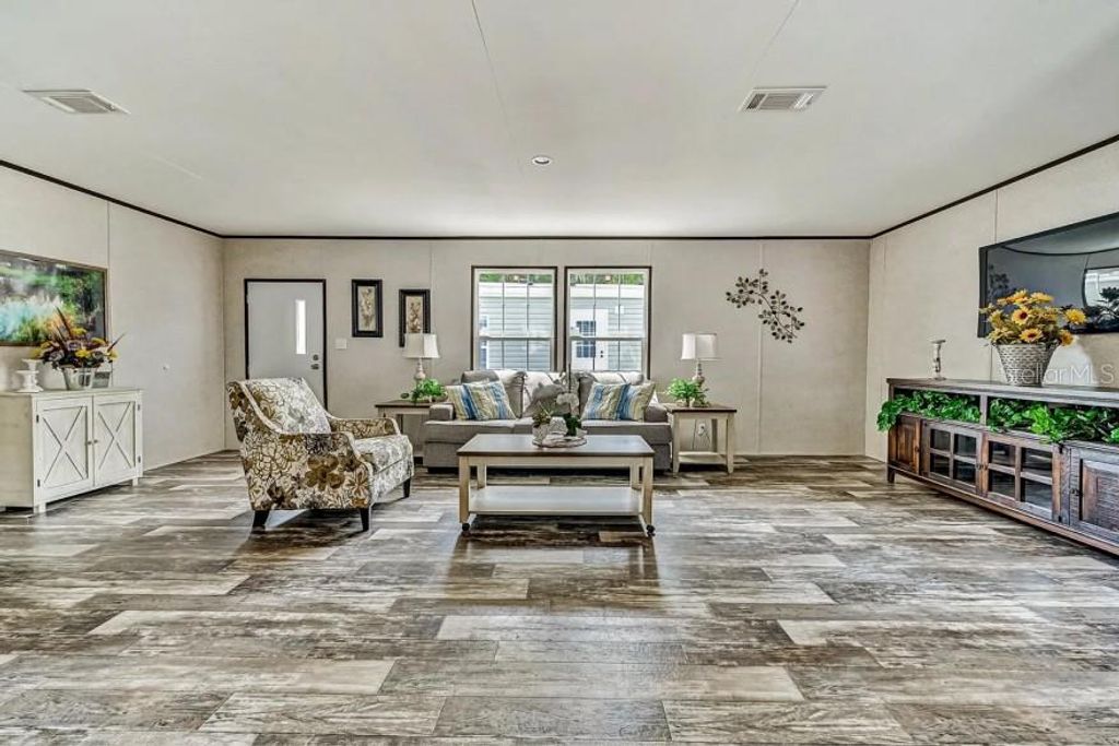 Photo of 3176 NW 74th Terrace, Okeechobee, FL 34972 (MLS # O6401382)