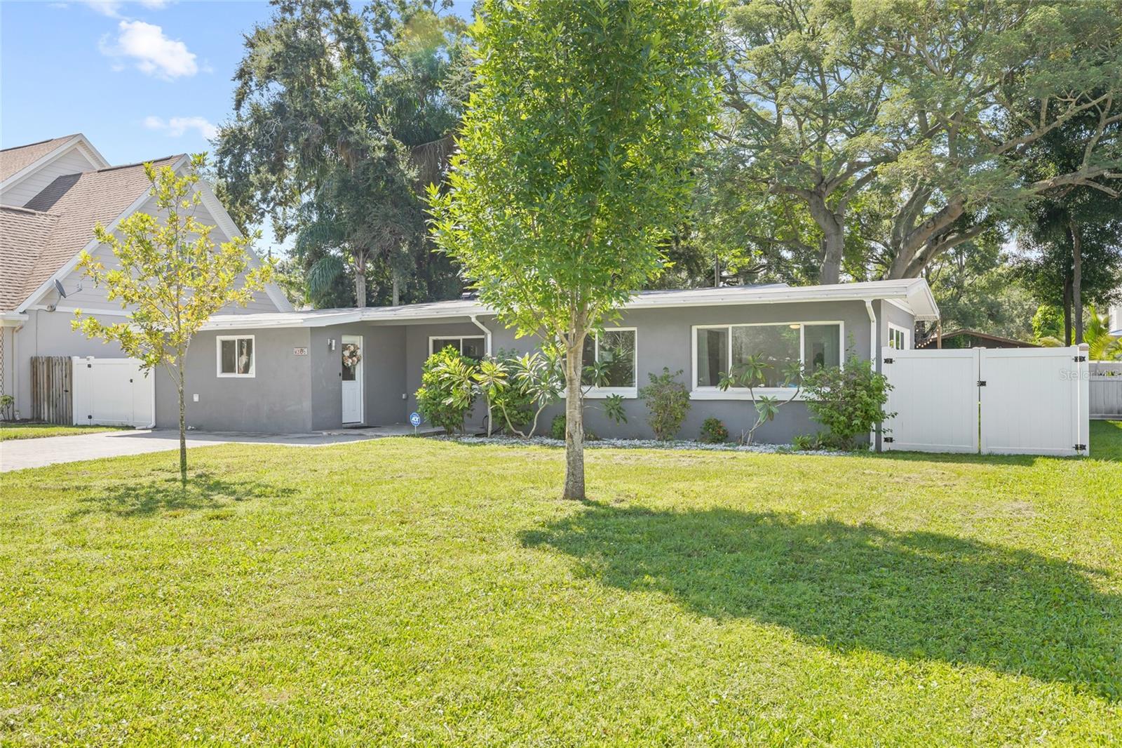 Move-in ready home located in coveted Swann Estates neighborhood of South Tampa. Zoned for the top-rated Plant School District. This 2,004 sq ft, 3 bedroom, 2 bathroom ranch has a recently updated kitchen, master bathroom and beautiful bamboo floors. The open floor plan conveniently combines the kitchen, living room, dining room and den. The large master bedroom suite includes a large walk-in closet with office area. Possibilities are endless with this home's oversized 10,125 sq ft lot. New Roof installed 2018, new AC unit installed 2024, all windows replaced. Flood Insurance not required. Conveniently located just minutes from Midtown, Downtown, Tampa International Airport, Selmon Expressway, I-275, and Veterans Expressway. Less than a 10 minute walk to parks, tennis courts and Little League.