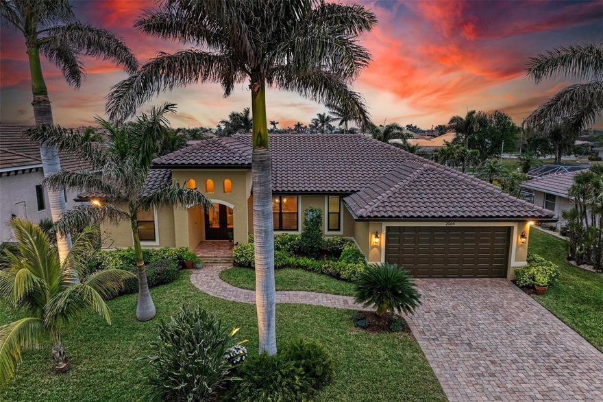 WATERFRONT LUXURY AWAITS at this gorgeous 2013 built custom POOL HOME with incredible and unique features! This 3-bedroom, 3 full bath –2,205 sqft air conditioned / 3,260 sqft total home on an 85’ x 120’ oversized lot has an oversized two car garage with a large climate-controlled storage room, a NEW cement tile roof with double underlayment, new soffit and 7” gutters, a refurbished cage, new garage epoxy flooring, all completed in 2024. Inside, enjoy two guest bedrooms, each with their own bathroom on the left side of the home, an open concept design including the dining room, spacious great room, kitchen and dinette all open to the outdoors via six - 8’ tall sliders that create indoor/outdoor spaces with wonderful views of the water and pool, a beautiful primary suite with dual walk-in closets and an en-suite bathroom with separate tub and walk-in shower, and upgraded dual vanities. Additional features include a large inside laundry room with extra storage, a commercial grade flagpole, upgraded landscaping, audio speakers in main living area and outside porches, Impact windows and Storm Smart hurricane shutters for lanai, 20” porcelain tile flooring throughout, tongue and groove ceilings in main living area and outside porches, a huge walk-in pantry large enough for a deep freeze off the beautiful gourmet kitchen, an amazing outdoor kitchen and bar with propane grill and additional two burner cooktop, a heated saltwater gunite pool that is 7’ deep, landscape decorative lighting, a fabulous 35' concrete dock with 20,000 lb lift, shore power, and 2 hose spigots. This home also is GENERATOR READY with a plugin adaptor for home power. Nearby to great shopping, restaurants, marinas, golf, parks and more, you will not want to miss this! BE SURE TO CLICK THE FULL VIRTUAL TOUR LINKS FOR DETAILS!