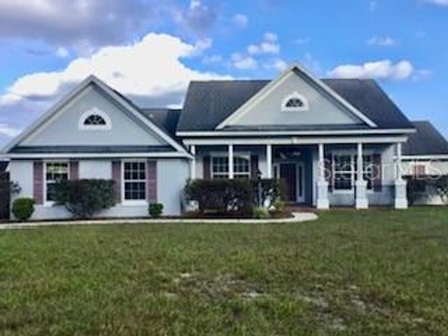 Gorgeous 2007 concrete house on 5.4 beautiful acres.  This home and property  has been meticulaously mailntained. It is fenced and cross fenced for safety for dogs and horses.  Custom built  2023 charming one stall , one tack room barn that opens to a paddock. Ideal for your horses or  ponies,  There is a 24 'x 36' pole barn that can be used for extra stalls or farm equipment or cars.  There is a circular driveway that makes it easy with a truck and trailer to get in an out. The house is set on a hill so the property is Not in a  flood zone.  Plus the views are amazing with the neighbors field of live oaks across the street.  Inside the home, the high vaulted ceilings make it very open and inviting.  The kitchen has stainless steel appliances, the refrigerator was purchased  new in 2024.  Separate laundry room  with washer and dryer  purchased new  in 2024. The master bedroom has a trey ceiling and has a large master bathroom with jacuzzi tup and shower.  Toilet in separate room.  The two guest rooms are on the other side of the home and large size bathroom in between with the toilet and shower in a separate room from the sink. Very well designed home for a family . The living room  has brand new vinyl plank  flooring and is open and inviting. The front porch of the home has brick walkways and elegant black railings. The back porch is covered and looks out to the large fenced dog area.  The Outside  of the home is breathtakingly gorgeous. There is a fenced 3 and half acre field with large old oak trees, a driveway, and a shade screened garden area with water spigots to it.  Also water spigots have been installed in the field for watering fruit trees and horses.  The well water is  delicious and there are also  filters in the house to make the water even better. Located 24 miles to WEC and 12 miles to Rainbows Springs.   This is truly a dream farm . Come and see this beautiful property.