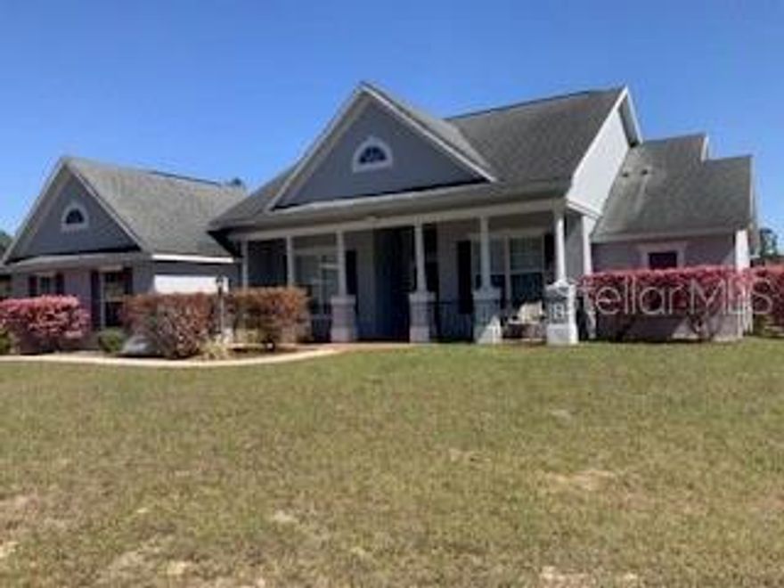 Gorgeous 2007 concrete house on 5.4 beautiful acres.  This home and property  has been meticulaously mailntained. It is fenced and cross fenced for safety for dogs and horses.  Custom built  2023 charming one stall , one tack room barn that opens to a paddock. Ideal for your horses or  ponies,  There is a 24 'x 36' pole barn that can be used for extra stalls or farm equipment or cars.  There is a circular driveway that makes it easy with a truck and trailer to get in an out. The house is set on a hill so the property is Not in a  flood zone.  Plus the views are amazing with the neighbors field of live oaks across the street.  Inside the home, the high vaulted ceilings make it very open and inviting.  The kitchen has stainless steel appliances, the refrigerator was purchased  new in 2024.  Separate laundry room  with washer and dryer  purchased new  in 2024. The master bedroom has a trey ceiling and has a large master bathroom with jacuzzi tup and shower.  Toilet in separate room.  The two guest rooms are on the other side of the home and large size bathroom in between with the toilet and shower in a separate room from the sink. Very well designed home for a family . The living room  has brand new vinyl plank  flooring and is open and inviting. The front porch of the home has brick walkways and elegant black railings. The back porch is covered and looks out to the large fenced dog area.  The Outside  of the home is breathtakingly gorgeous. There is a fenced 3 and half acre field with large old oak trees, a driveway, and a shade screened garden area with water spigots to it.  Also water spigots have been installed in the field for watering fruit trees and horses.  The well water is  delicious and there are also  filters in the house to make the water even better. Located 24 miles to WEC and 12 miles to Rainbows Springs.   This is truly a dream farm . Come and see this beautiful property.