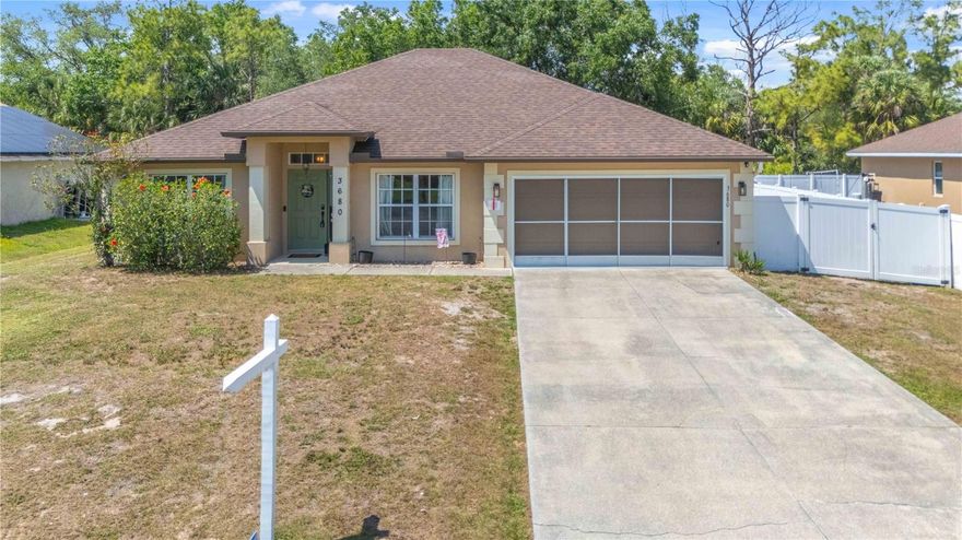 Welcome to your piece of paradise! The asking price includes a BRAND-NEW ROOF that is about to be put on!!! No HOA fees, no flood insurance required, impact windows, and hurricane shutters for the front door/lanai all helping to keep your monthly expenses low and your home protected! This property also has a 2020 AC and a fully fenced in back yard. Upon Arriving to the home you will notice the attractive curb appeal and once inside you will be greeted by tall ceilings and unique touches throughout the home. The kitchen features newer stainless-steel appliances, a large island, and plenty of cabinet storage along with a pantry. The master suite is oversized with a large walk-in closet, garden tub, walk in shower, and his & her sinks. The second and third bedrooms are on the opposite side of the home giving you privacy along with the guest bathroom and interior laundry room. There is also a 4th bedroom at the front of the home with French doors that could also be used as an office, game room, or den. The septic was inspected and pumped in December 2025 without any issues and the property can be sold furnished is desired. Ask your agent for the fully interactive 3D tour and prepare to fall in love.