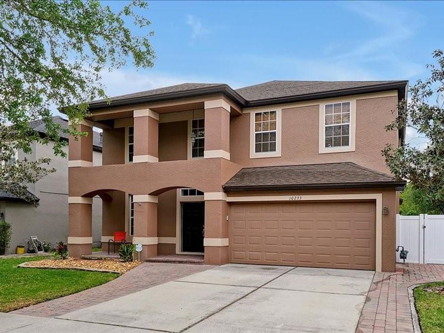 One or more photo(s) has been virtually staged. Experience elevated Central Florida living in the highly desirable Moss Park Landings community, ideally positioned within the vibrant Lake Nona area. 10233 Serotina Court blends comfort, style, and convenience in one of Orlando’s most dynamic and rapidly growing locations. This beautifully cared-for home welcomes you with an inviting presence and a spacious layout designed for both everyday living and memorable entertaining. Bright, open living spaces create a seamless flow throughout the home, while the generously sized kitchen offers abundant cabinetry, expansive counter space, and effortless connection to the main gathering areas. Thoughtfully designed bedrooms provide a relaxing retreat, while the outdoor living area offers the perfect setting for morning coffee, weekend gatherings, or peaceful Florida evenings.

Notable upgrades and features include a back patio with water and electricity, a new roof (3 years old), a 2019 AC climate control system valued at approximately $14K, a garage mini split AC, insulated garage door with security lock, tankless water heater, new water filtration system (6 months old), home alarm system, smart home system, new shower in the second bathroom, new glass installed in the master shower, pavers surrounding the entire home, and a fenced backyard for added privacy. The property also benefits from no CDD fees, a low HOA of under $1,000 annually, and single ownership since construction.

Location is everything, and this home delivers exceptional accessibility with convenient access to Narcoossee Road, SR-417, SR-528, Orlando International Airport, Medical City, and the expanding Lake Nona Town Center. Residents will also appreciate close proximity to the highly anticipated upcoming Nona West lifestyle and shopping destination, bringing even more dining, retail, entertainment, and everyday conveniences to this already thriving corridor. Surrounded by beautiful communities, parks, recreation, and top-rated schools, this property offers the ideal blend of suburban tranquility and urban accessibility. Whether you are looking for your forever home, a stylish upgrade, or a property in one of Central Florida’s most sought-after growth areas, this exceptional residence presents an incredible opportunity to enjoy the very best of the Lake Nona lifestyle.