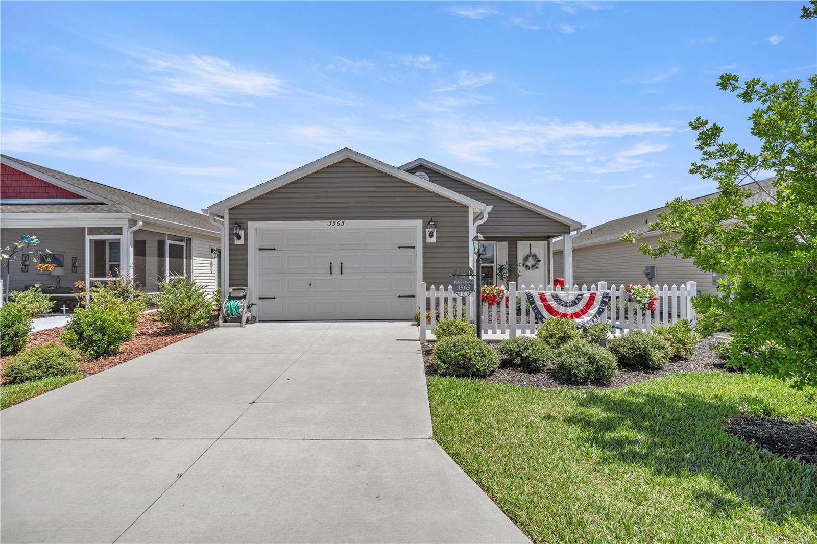 This LIGHT & BRIGHT 2 bedroom/1 bathroom Extended "Vineyard" patio Villa located in the beautiful Village of Hammock at Fenney with majestic oak trees!. Built in 2021, this 2/1 Villa will make the perfect second home, investment property, or full-time residence that is both Manageable & Move-in-Ready! The exterior features a Low-Maintenance Landscaping & Privacy Fence along the rear, with a generous backyard - great for dog lovers. Spacious interior with VAULTED CEILINGS. The Kitchen boasts beautiful Cabinets , STAINLESS Appliances, GAS COOKING, Pantry Storage, & INSIDE LAUNDRY. Additional features: INTERIOR LAUNDRY and PRIVACY, quiet street, not close to the Turnpike or 301 traffic noise. The well-appointed kitchen boasts modern appliances, ample counter space, and plenty of cabinets for storage, making it a chef's delight for preparing meals and entertaining guests. The adjacent dining area offers the perfect setting for enjoying casual meals with family and friends. Retreat to the master bedroom suite, a tranquil oasis featuring a generously sized bedroom with Luxury Vinyl Planking and a private ensuite. The second bedroom is equally comfortable and versatile, ideal for accommodating guests, creating a home office, or pursuing hobbies. Big and beautiful wheelchair accessible bathroom. Brand new gutters installed. Step outside to your private oasis, where you can relax and unwind while enjoying the beautiful Florida weather. Whether you're sipping your morning coffee, or simply basking in the sunshine, this outdoor space will become a favorite spot for enjoying the outdoors. This patio villa also offers convenient features such as ample storage space, a laundry area, and a 1.5-car garage. Additionally, as a resident of The Villages, you'll have access to many amenities and activities, including golf courses, swimming pools, recreation centers, and social clubs, ensuring there's always something exciting to do right at your doorstep. This home is conveniently located near shopping, dining, medical facilities, and major highways and offers tranquility and convenience. Whether you're seeking a permanent residence or a seasonal retreat, this 2-bedroom, 1-bathroom patio villa in The Villages, Florida, offers a wonderful opportunity to embrace the coveted Florida lifestyle.