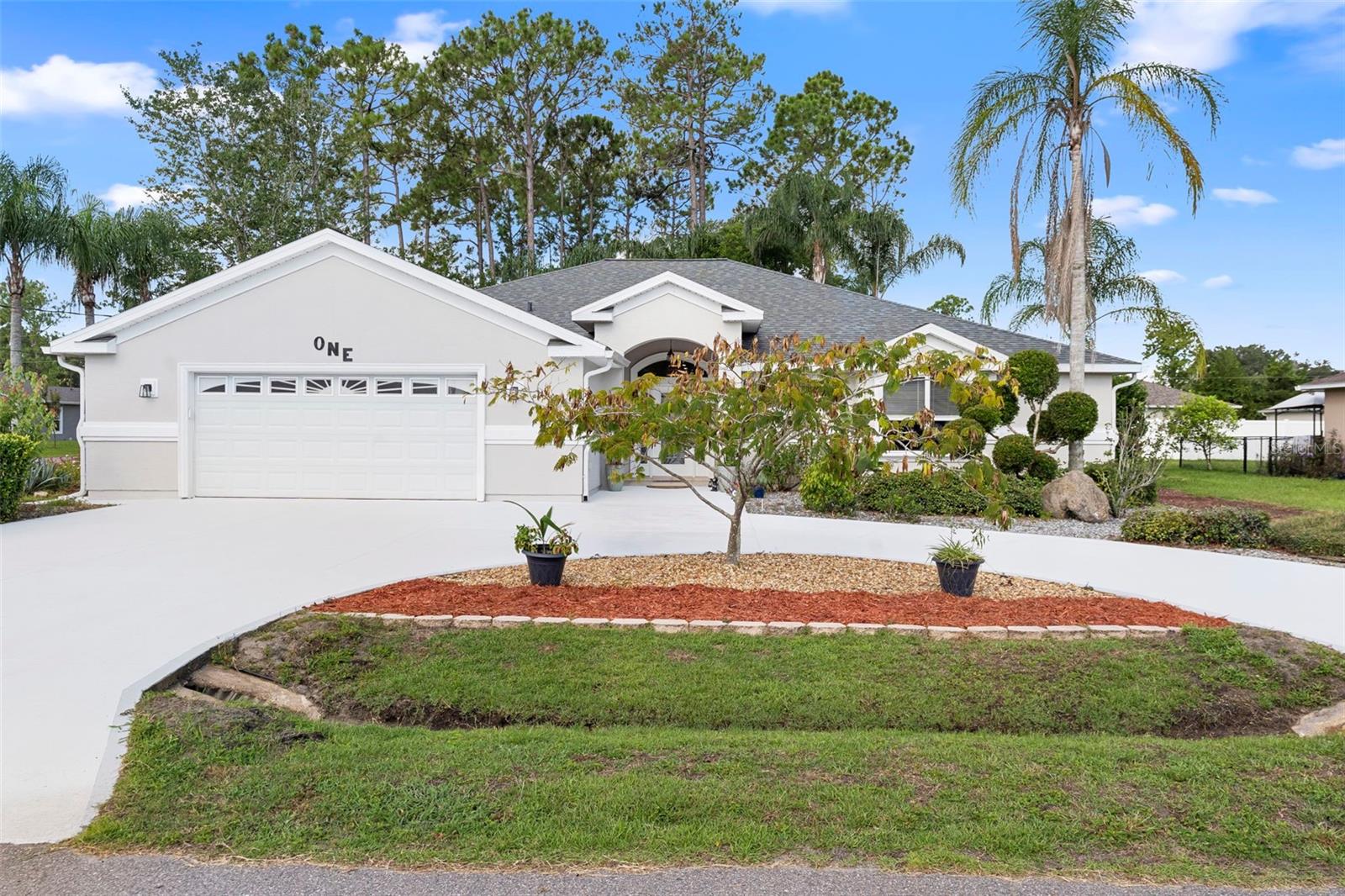 Why buy a production home when you can have a luxury custom owner-builder home. This thoughtfully designed, impeccably maintained custom home was built from the ground up with superior materials, design and specifications that will last the test of time. Roof and water heater only 3 years old & new 4 ton 2-speed HVAC. Home sits on an oversized corner lot (option available to purchase rear corner lot) with a huge sought-after horseshoe driveway, extended (26' x 29') 2-car garage to fit your vehicles (can accommodate a full bed truck) and room for additional storage to spare. As you enter the home through a spacious foyer you will be welcomed with a large high-ceiling open floor plan featuring a custom designed (16' x 24') home theater room (equipment included), a living room that includes a built-in 75" Sony 4K TV with an electric fireplace & spacious formal dining room. Chef kitchen featuring custom space-saving cabinets, pantry, stainless steel appliances and large island with recessed power outlets. The primary bedroom offers custom build out with lighting & shelves, double trey ceiling, access to back patio and owner suite bathroom with seamless large shower entry and walk in closet. The second bath was recently renovated. Flex room offers custom shelving, LED lighting and can double as an extra bedroom. A large screened-in patio offers custom cypress wood detailing, wet bar along with a brand new 5-person jacuzzi that leads to a tropical oasis. New meticulous landscaping throughout the exterior. Centrally located to hospitals, schools, shopping and much more book your private showing today.