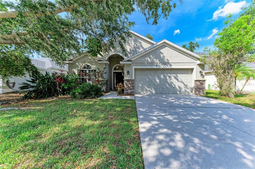 Discover this beautifully maintained Scarborough model home in the highly sought-after community of Oakley Place. Ideally situated just off I-75, this residence offers exceptional convenience without any of the traffic noise, while remaining minutes from shopping, dining, and waterfront attractions.Step inside to an inviting, open-concept layout where the living room and dining area seamlessly flow into the spacious kitchen and family room—creating the perfect setting for entertaining family and friends. The thoughtfully designed split-bedroom floor plan places secondary bedrooms 2 and 3 away from the primary suite, sharing a full bathroom for added privacy.The generous primary suite features a versatile fourth bedroom (ideal as a home office or nursery), an oversized walk-in closet, and a private en-suite bathroom. Outside, enjoy a tranquil, fully fenced backyard complete with a screened lanai and a cozy fire pit area—perfect for relaxing or outdoor gatherings.With newer appliances, move-in-ready condition, a low HOA fee, and an unbeatable location, this home truly stands out.  AC unit with multi stage compressor for Energy saving.Schedule your private showing today and experience all that Oakley Place has to offer.