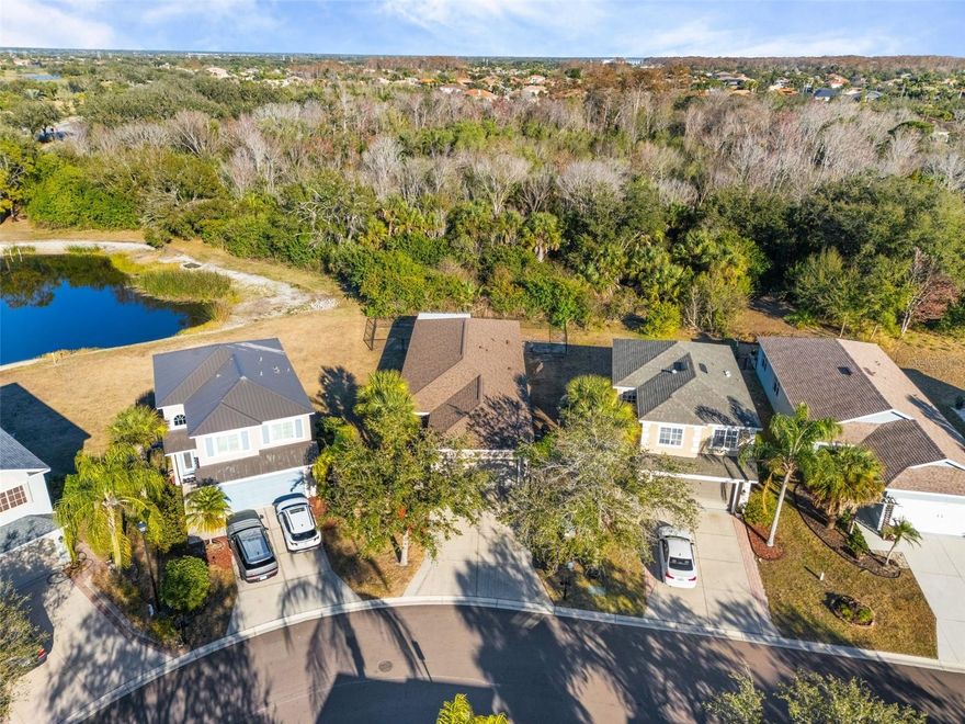 One or more photo(s) has been virtually staged. MOVE IN READY!!! Welcome to this beautifully maintained single-story home in the heart of Heritage Harbour, offering THREE rooms and two bathrooms on an OVERSIZED PRESERVE LOT and NO rear neighbors. FULLY FENCED YARD. The third bedroom is a converted den currently used as a bedroom and does not include a closet, making it a flexible space ideal for a home office or guest room. HIGH ceilings and abundant NATURAL LIGHT create an open, airy feel throughout. The kitchen features STAINLESS STEEL appliances updated in 2019 and opens to a dedicated dining or seating area overlooking the front yard. This home is truly move-in ready with a NEW ROOF (2023), a 2020 three-ton AC unit, and a LOW HOA. Interior features include a WASHER and DRYER that convey, window blinds, ceiling fans throughout, and a fully paid-off SECURITY SYSTEM with hard-wired cameras, Ring camera and smart thermostat. The garage is well equipped with overhead storage, a refrigerator that conveys, a 240-VOLT charging outlet for compressor hookup or tesla charging. Exterior highlights include a WIDENED driveway for additional parking, hurricane shutters, and a full IRRIGATION system using reclaimed water. Residents enjoy a welcoming community setting with access to a large park, sports fields, playgrounds, picnic areas, scenic walking and biking trails, a disc golf course, and a fishing pier on Beacon Lake. Notably, residents also have access to Stony Brook at Heritage Harbour’s public golf course, restaurant, and pro shop. Conveniently located at the entrance of Heritage Harbour is the new Market Place, featuring popular retail and dining options such as LongHorn Steakhouse, Miller’s Ale House, Costco Wholesale, Target, Hobby Lobby, Academy Sports, and more. With easy access to shopping, dining, parks, golf courses, and I-75, this location truly offers the best of convenience and lifestyle. Schedule your showing today before it’s gone.