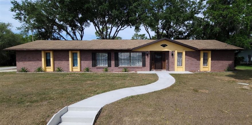 Welcome to this well-maintained 3-bedroom, 2-bath home offering 1,706 sq ft of living space within the city limits of Inverness. Conveniently located just minutes from shopping, dining, medical facilities, and the Withlacoochee State Trail, this home combines comfort, function, and accessibility. Inside, you’ll find an oversized 1-car garage and a thoughtful floor plan designed for everyday living and entertaining. The spacious dining room features a cozy wood-burning fireplace as its focal point, creating a warm atmosphere for meals and gatherings. The dining area flows into a functional kitchen with a large breakfast bar and into the living spaces, making the layout ideal for both relaxation and hosting. The primary suite includes a separate en-suite bath with large, step in shower, while two additional bedrooms share a second full bathroom equipped with tub/shower. Step outside to a screened patio overlooking the private backyard—perfect for morning coffee, evening relaxation, or entertaining guests. A storage shed offers additional space for lawn and garden tools. Recent updates include: Roof (2018), electrical panel, water heater, exterior paint, and all interior plumbing shut-offs and feed lines (2021). This home is ready for you to make it your own—schedule your showing today!