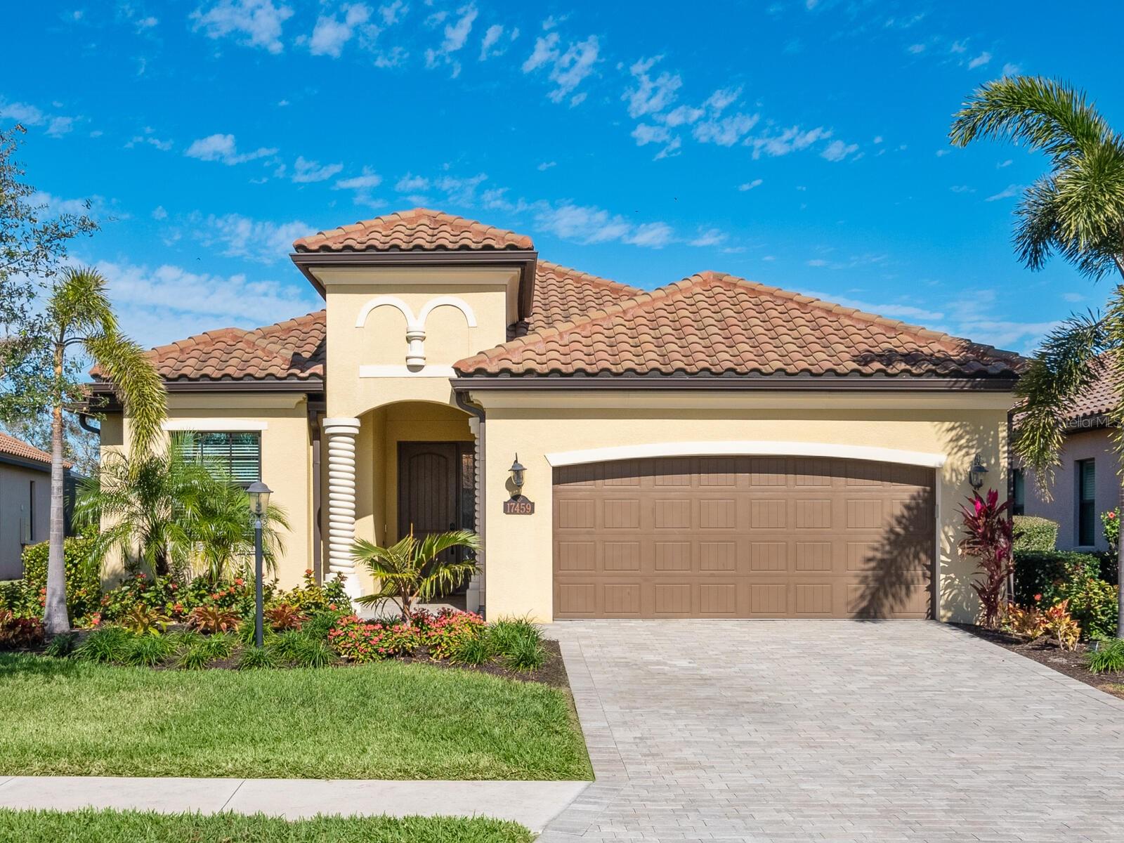 One or more photo(s) has been virtually staged. Experience the perfect blend of comfort and sophistication in the Isabella model, featuring 4 bedrooms (4th currently an office) and 2 bathrooms, saltwater pool and spa and 2 car garage! Located in the fabulous Lakewood National Golf Club, a 36-hole Arnold Palmer-designed golf community in Lakewood Ranch, this fully established, resort-style neighborhood offers exclusive access to championship golf and premier amenities.
An inviting foyer leads into the open-concept kitchen, dining, and living area, perfect for entertaining. The well-designed kitchen boasts a large island with seating, stainless steel appliances, abundant cabinetry, and an oversized pantry. A private split-bedroom guest suite features two bedrooms sharing a full bath. The laundry room, complete with a utility sink and cabinetry, is conveniently located near the 2-car garage.
The expansive primary suite is a true retreat, featuring a tray ceiling, cozy sitting area, and two spacious walk-in closets. The luxurious ensuite bath includes dual vanities, a soaking tub, walk-in shower, a linen closet, and a private water closet.
Enjoy Luxury Vinyl Plank flooring throughout the bedrooms and office. Outdoors, relax in your private backyard oasis, complete with a summer kitchen, saltwater pool and spa, framed by the serene preserve views.
Beyond the home, indulge in Lakewood Nationals resort-style amenities, including a beach-entry lagoon pool, poolside dining, a Tiki bar, a luxury spa, a state-of-the-art fitness center, and a Grand Clubhouse with fine and casual dining. Stay active with tennis, pickleball, bocce courts, and world-class practice facilities, all within a gated community with 24-hour security. As a resident, you will also enjoy an included membership to two championship Arnold Palmer-designed golf courses, ensuring every round feels like a getaway!
