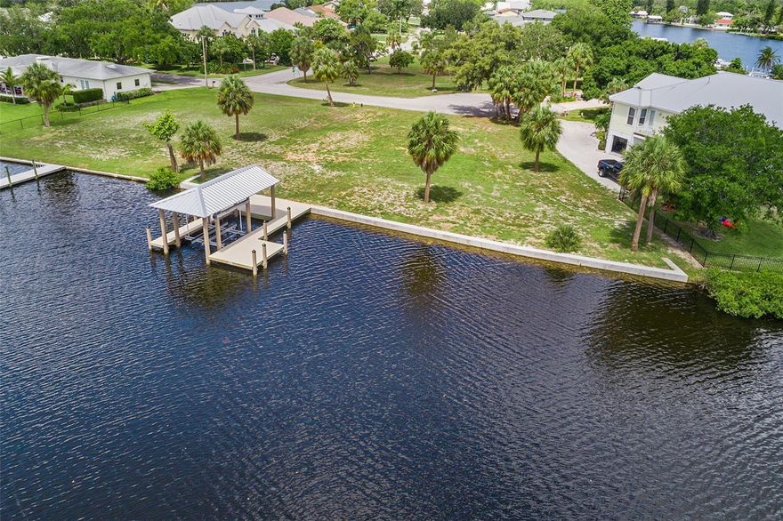 Located just outside of Apollo Beach between Bradenton and Tampa and minutes to St. Petersburg discover your dream waterfront property just minutes from Tampa Bay! Escape to your own piece of paradise with this spectacular 145’ deep water, waterfront lot. Located in a serene and sought-after neighborhood. Here’s why you’ll fall in love with it: Nestled along the Ruskin Inlet this lot gives bridge fee access to Tampa Bay and the Gulf of America. This impressive 99x145, 0.32-acre lot offers the perfect canvas to build your custom-designed home. Nestled in a quiet residential neighborhood, this property provides a peaceful retreat with convenient access to urban amenities. Immerse yourself in the serene ambiance of a deep-water canal, perfect for relaxing evenings and picturesque sunsets over the horizon while watching the manatee and dolphins swim by in your own backyard. Benefit from a newly constructed concrete seawall featuring a covered composite 40’ dock and an impressive 18,000 lb. capacity boat lift. Whether you envision a contemporary oasis, or a charming coastal cottage, this lot offers limitless potential to create your perfect getaway. Approximately 30 minutes to Tampa, St. Petersburg, Bradenton and Sarasota. Don’t miss out on this rare opportunity to own a piece of waterfront paradise. Whether you're seeking a permanent residence or a weekend getaway, this lot promises an unparalleled waterfront lifestyle. Call today to schedule your viewing and start envisioning your future, your dream waterfront lifestyle awaits! The Buyer and Buyer’s agent are responsible for verifying all inspections and listing information.