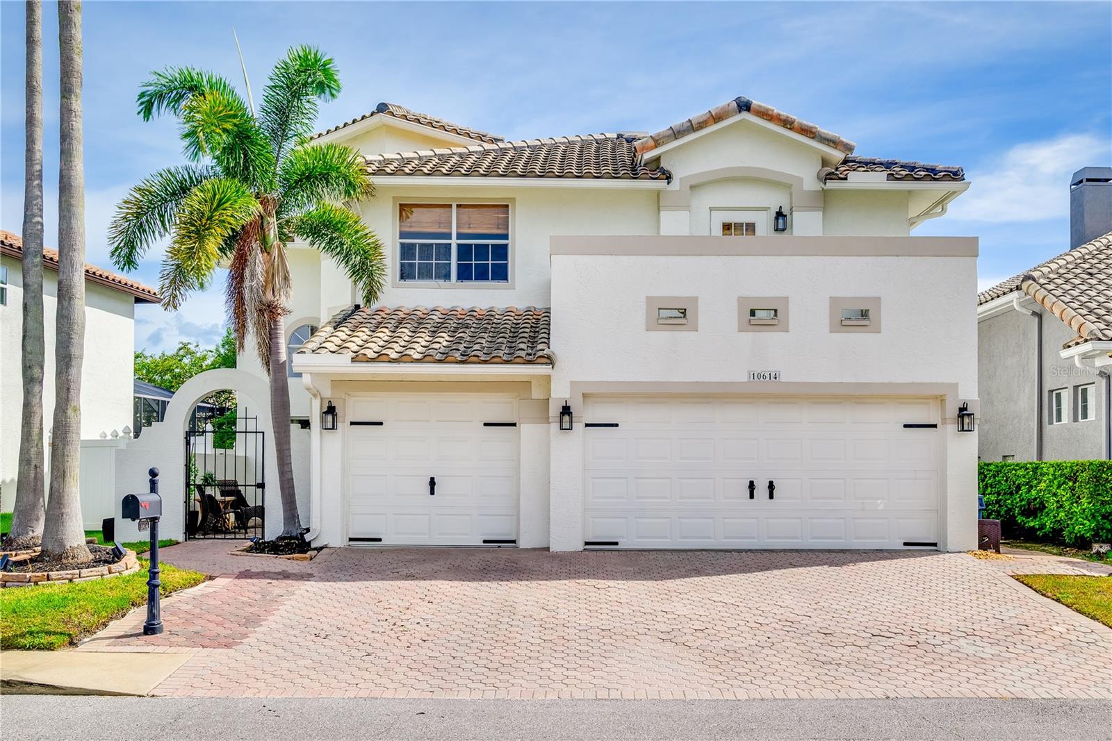 Step into this beautifully reimagined 4-bedroom, 4-bath home with a versatile den—easily used as a 5th bedroom—located in the gated waterfront community of Palm Bay. Featuring a spacious 3-car garage, this residence welcomes you with soaring ceilings, updated fixtures, fresh interior paint, and a seamless layout that flows effortlessly into the main living areas.
Designed for both everyday living and entertaining, the open-concept living and dining areas lead directly to a screened-in pool and covered lanai, perfect for indoor-outdoor Florida living. The chef’s kitchen overlooks the backyard oasis and connects to the outdoor space through upgraded hurricane-rated sliding doors.
Upstairs, the private primary suite is a true retreat, featuring two spacious walk-in closets, an oversized en suite bath, and large private balcony escape. Just beyond, you’ll find three additional bedrooms—one with a private en suite bathroom, another offering a tranquil balcony escape, and a third currently outfitted as a home gym.
On the main level, the den offers flexibility as a home office or guest suite, complete with its own private access to the backyard.
Enjoy peace of mind with newly rescreened and retreated windows, updated lighting, new ceiling fans throughout, a brand-new washer and dryer, and zero storm surge or water intrusion from Hurricanes Milton or Helene.
Palm Bay residents enjoy access to a private marina with no-bridge Gulf access, boat ramp, kayak launch, tennis and basketball courts, playground, and dog park—all just minutes from Tampa International Airport, world famous beaches, and vibrant downtown destinations.