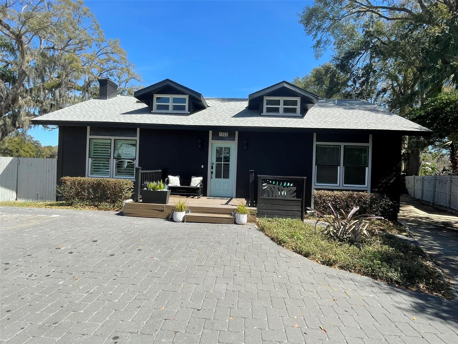 LUXURIOUS LAKEFRONT LIVING IN THE HIGHLY SOUGHT AFTER HOURGLASS DISTRICT!! THIS INCREDIBLY BEAUTIFUL HOME HAS ENDLESS INCOME OPPORTUNITIES AND NO HOA!!! THE MAIN HOUSE (1950 SQ FT) HAS 3 BEDROOMS AND 3 FULL BATHS PLUS A LOFT BEDROOM WITH ROOM FOR AN OFFICE. GOURMET KITCHEN AND OPEN FLOOR PLAN WITH ALL THE BELLS AND WISTLES. VAULTED WOOD CEILINGS, WET BAR, GRANITE COUNTER-TOPS, STAINLESS-STEEL APPLIANCES AND TANKLESS GAS WATER HEATER. THIS ONE-OF-A-KIND HOME WAS COMPLETELY REMODELLED IN 2021 WITH DESIGNER FEATURES THROUGOUT. SITTING ON THE BACK PORCH, YOU FORGET YOU ARE LOCATED IN THE HEART OF THE CITY AS YOU ENJOY THE WILDLIFE WITH INCREDIBLE VIEWS. THIS PROPERTY COMES FULLY LOADED AND FURNISHED! A TURNKEY AIR B AND B READY FOR GUESTS. ALL YOU NEED IS A SUITCASE AND YOU ARE HOME READY AND/OR INCOME PROODUCING! BACK BUILDING (1120 SQ FT) HAS TWO UNITS CURRENTLY BEING RENTED OUT AS AIR B AND B’S. LIVE IN THE MAIN HOUSE AND RENT THE BACK OUT OR LIVE IN ONE OF THE SMALLER UNITS AND RENT OUT THE FRONT HOUSE OR USE IT ALL FOR YOURSELF WITH PLENTY OF ROOM FOR GUESTS IN THE DETATACHED ADU! OR RENT OUT ALL THREE! LOCATED NEAR I4, BOONE HIGH SCHOOL, SHOPPING CENTERS, AND ORLANDO'S WORLD CLASS ATTRACTIONS. DO NOT MISS OUT ON THIS CUSTOM HOME AND INCOME PRODUCING OPPORTUNITY!!!