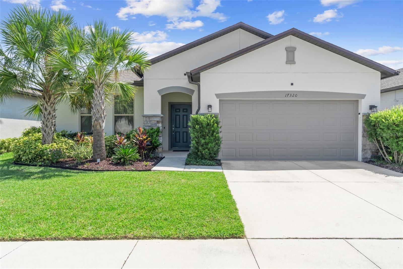 WAKE UP TO WATER VIEWS IN THIS SERENOA SHOWSTOPPER! This beautifully designed 4-BEDROOM, 3 FULL-BATH HOME offers nearly 2,000 SQUARE FEET of thoughtfully planned living space, nestled in one of CLERMONT’S MOST DESIRABLE RESORT-STYLE COMMUNITIES. From the moment you arrive, you’ll be greeted by LUSH LANDSCAPING AND ELEGANT STONE ACCENTS—just the beginning of what makes this home truly special. Step inside to a POPULAR OPEN FLOOR PLAN where you can enjoy GORGEOUS WATER VIEWS right from your living room, kitchen, and dining area. TILE FLOORING THROUGHOUT THE MAIN LIVING AREAS keeps things easy to clean and stylish, while CARPETED BEDROOMS add comfort and warmth. The spacious KITCHEN IS A DREAM, featuring 42” CABINETS WITH PULL-OUTS, a LAZY SUSAN, GRANITE COUNTERTOPS, a WATER FILTRATION SYSTEM, a LARGE ISLAND with STYLISH PENDANT LIGHTS—perfect for entertaining or casual family meals. The 4TH BEDROOM is ideal for guests or multi-generational living, offering LARGE WINDOWS THAT BRING IN BEAUTIFUL NATURAL LIGHT, along with a PRIVATE ENSUITE BATH for added privacy and comfort. The PRIMARY SUITE is a peaceful retreat with a BEAUTIFUL CEILING FAN, a LARGE WALK-IN CLOSET, and a PRIMARY BATHROOM featuring a TILED SHOWER AND DOUBLE VANITY. Plus, enjoy TRANQUIL WATER VIEWS RIGHT FROM YOUR BEDROOM WINDOW—a perfect way to start and end each day. The LAUNDRY ROOM is thoughtfully upgraded with CABINET STORAGE, a DOUBLE WASHER PERFECT FOR BOTH SMALL AND LARGE LOADS, and a UTILITY SINK. Step outside to your SCREENED-IN PATIO WITH A CEILING FAN, where you’ll love starting your day with GORGEOUS SUNRISES OVER THE WATER—a peaceful space to relax and take in the natural beauty. Additional features include a 2-CAR GARAGE WITH A 220V ELECTRIC CAR CHARGER, a WHOLE-HOME WATER SOFTENER, GUTTERS ALREADY INSTALLED FOR ADDED HOME AND LANDSCAPE PROTECTION, and a ROOF THAT’S ONLY 2 YEARS OLD, along with THOUGHTFUL TOUCHES THROUGHOUT. Beyond the home, CLERMONT OFFERS A LIFESTYLE UNLIKE ANYWHERE ELSE IN CENTRAL FLORIDA—RICH WITH ROLLING HILLS, SCENIC LAKES, WALKING AND BIKING TRAILS, OUTDOOR ADVENTURES, CHAMPIONSHIP GOLF, SHOPPING, DINING, AND LOCAL ENTERTAINMENT. It’s no wonder Clermont has been named one of the TOP 15 LAKE TOWNS IN AMERICA and recognized by Southern Living as one of the BEST PLACES TO RETIRE. And exciting news—SAWGRASS BAY BLVD IS OPENING SOON JUST 1.1 MILES AWAY, making your drive to DISNEY FASTER THAN EVER and placing you just moments from WINTER GARDEN, major stores, restaurants, and more. All of this is located in SERENOA, a community packed with amazing amenities including a RESORT-STYLE ZERO-ENTRY POOL, SPLASH PARK, CLUBHOUSE, FITNESS CENTER, WALKING TRAILS, AND A DOG PARK. It’s an ACTIVE NEIGHBORHOOD perfect for all lifestyles. If you're searching for your FOREVER HOME, this home delivers VALUE, COMFORT, AND VIEWS YOU’LL LOVE COMING HOME TO.