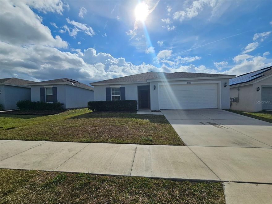 Presenting a meticulously maintained single-family home in Haines City, constructed in 2021. This residence offers a seamless blend of comfort and modern updates, making it an excellent opportunity.

Inside, the home features a thoughtfully designed kitchen equipped with a central island and new black stainless steel appliances, creating an inviting space for daily living and entertaining. New vinyl plank flooring extends throughout the entire home, complemented by a freshly painted interior, ensuring a contemporary feel. A brand-new washer and dryer are also included.

Enjoy scenic views from this well-situated property. The lot provides a pleasant outdoor environment for relaxation or activities. Situated in a community known for its well-maintained homes and suburban atmosphere, residents benefit from communal green spaces and sidewalks.

Conveniently located near Haines City Mall for shopping and dining, and Lake Eva Park for recreational activities. Essential amenities, including Publix Super Market, are easily accessible. This property offers a compelling opportunity for those seeking an updated home in a desirable Haines City location.