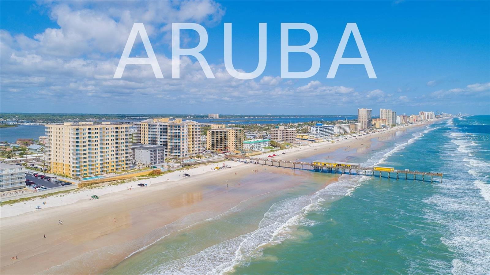 Luxury living on the beach awaits from this like-new, turn-key sky home offering stunning sunset scenes and toes in the sand in just seconds. One of the most highly sought condo properties in Central Florida, Aruba is a lavish oceanfront retreat providing the opportunity for weekly rental income. With a dramatic riverfront balcony that wraps around to the northeast for amazing ocean scenes, this condo provides awe-inspiring views all day long! Inside you will find convenient tile flooring throughout the entire residence, while the ample kitchen is a chef's dream, featuring solid wood cabinetry, stainless steel appliances, and gorgeous granite counters. With three bedrooms, this condo is well-equipped for family stays and strong rental demand. Come explore Aruba, a resort-like condominium bolstered by a heated, oceanfront swimming pool, a fitness facility, a clubroom, EV chargers, and a private walkway to the beautiful beach. Don't miss out on this one!