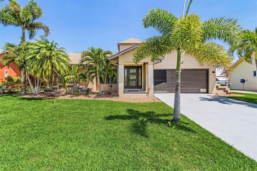 Welcome to 3810 Barnegat Drive...An exceptional WATERFRONT home that truly stands out from anything else on the market. FULLY REMODELED and **NEVER FLOODED**, this property offers peace of mind along with elevated coastal living.
From the moment you arrive, the lush tropical landscaping and meticulously maintained lawn set the tone. Tucked inside Punta Gorda’s hidden gem, San Sebastian Harbor—a quaint community of roughly 50 homes. You’ll find this spacious 3-bedroom, 2-bath retreat designed for both comfort and style.

Inside, the open split-bedroom layout and vaulted ceilings create a bright, airy feel throughout. The home has been thoughtfully updated from top to bottom, featuring a stunning kitchen with crisp white cabinetry, a large quartz island with pendant lighting, stylish backsplash, coffee bar, built-in pantry, and stainless steel appliances. The luxurious primary suite has been beautifully renovated with dual vanities, a spacious walk-in shower with frameless glass, and elegant tile finishes. Additional upgrades include LVP wood look flooring, updated vanities, and modern finishes throughout.

Step outside to a covered back porch overlooking the water, then into your own private oasis featuring professionally designed landscaping, irrigation, and a charming palm-lined cabana that creates a true resort-style setting right in your backyard.

Major improvements include a 2015 septic system, a 2022 roof, newer interior and exterior paint, custom blinds, and a nearly new 10k lb boat lift. The dock has just been freshly stained, and the boat lift cover was replaced in 2024. The home is also equipped with PGT Winguard impact windows, impact-resistant doors (including garage and service doors), a LiftMaster smart WiFi-enabled garage opener with MyQ camera, Culligan water softener and filtration system, upgraded garage screen system, and more.

Enjoy all that San Sebastian Harbor offers, including a heated community pool, clubhouse, and tennis courts. With direct water access from your backyard, endless boating and fishing adventures await. Keep your boat on your private dock with a new lift and remote for ultimate convenience.

This is a rare opportunity to own a beautifully updated waterfront home in one of Punta Gorda’s most charming communities.