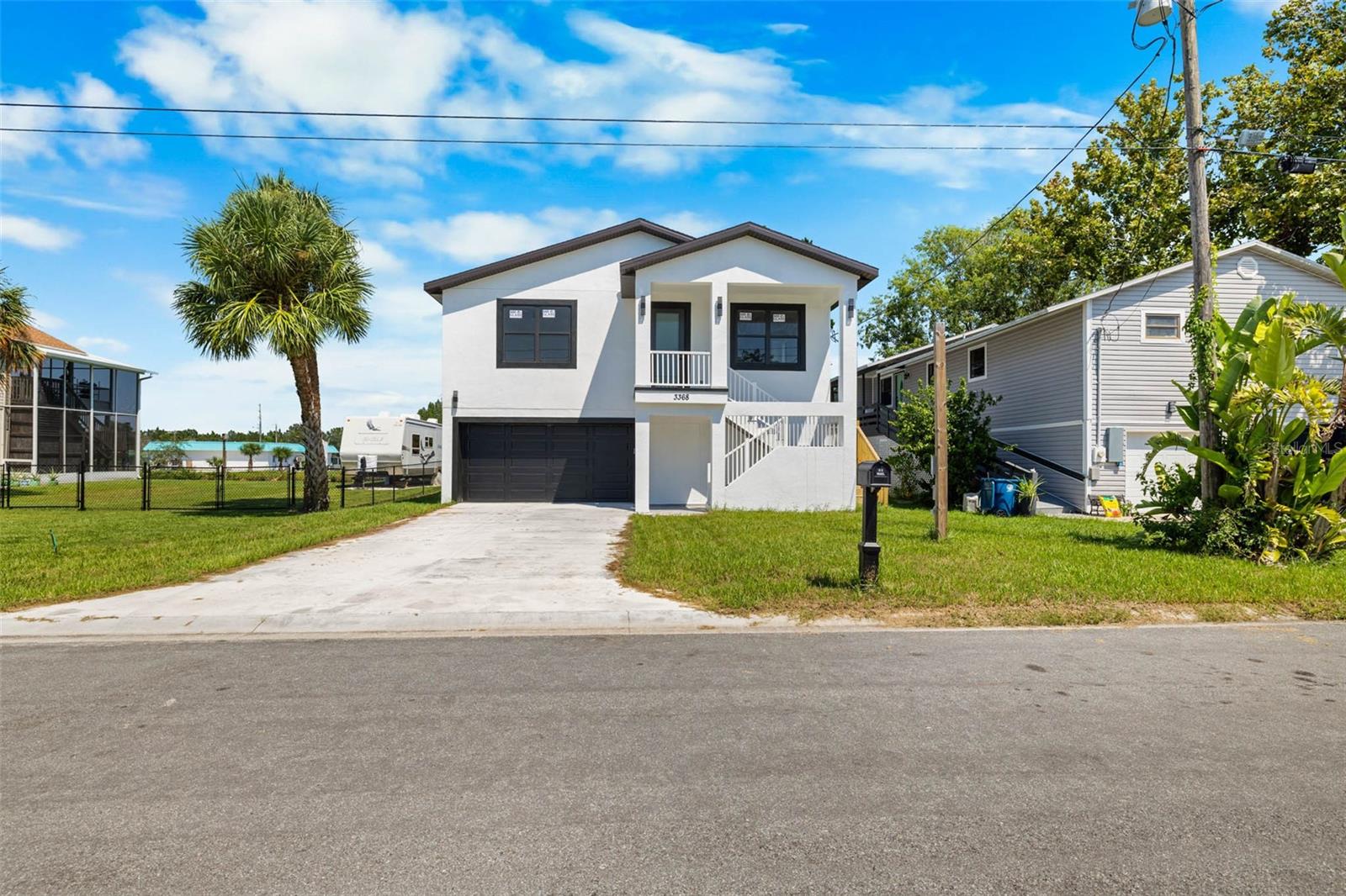 MOVE IN READY, NEW CONSTRUCTION HOME WITH PRIVATE BOAT RAMP & DRIVE-THROUGH GARAGE AND BUILDER WARRANTY!
Experience the perfect blend of coastal charm and modern elegance in this open-concept 3 bedroom, 2 bath split-floorplan waterfront home. Designed for the boating lifestyle, the ground level provides expansive parking for 4+ vehicles, plus space for a game room, workshop, or endless possibilities. With double garage doors, you can conveniently drive a boat through the first level directly onto your private boat ramp.
Upstairs, the gourmet kitchen features white shaker cabinets, stainless steel appliances, quartz countertops, and a spacious eat-in island. The kitchen flows seamlessly into the bright living room with slider access to the balcony, while the front room serves perfectly as a dining space or flexible bonus area.
The primary suite offers a large walk-in closet, private porch access, and an en-suite bath with a double vanity and glass-enclosed shower. Two oversized guest bedrooms share a stylish bath with a tub/shower combo, ideal for family or visitors.
Just minutes from the boat lift, this property combines modern finishes, versatile space, and a true waterfront lifestyle.
Home is constructed on pilings with break away walls and impact windows and doors.
Hernando Beach is a vibrant waterfront community that offers the best of coastal living—boating, kayaking, paddleboarding, fishing, and more. Just minutes from the world-famous Weeki Wachee Springs, residents also enjoy close proximity to shopping, dining, and hospitals. The community is golf cart friendly and allows short-term rentals with no HOA, no deed restrictions, making it perfect for full-time residents, part-time snowbirds, or investors. The Suncoast Parkway offers easy commuting to Tampa, Brooksville, and beyond. This is your chance to own a piece of paradise.