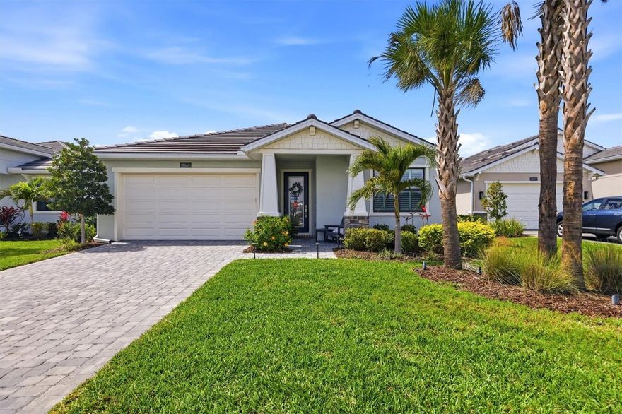 Experience refined Florida living in this exceptional residence located in the sought-after community of Solstice at Wellen Park, masterfully built by luxury builder Toll Brothers. Designed with quality craftsmanship and upscale finishes throughout, this extensively upgraded home offers 3 bedrooms plus a flex room, 2.5 baths, and an oversized 2.5-car garage.

From the moment you enter, you’ll appreciate the custom built-in features including designer bookshelves and custom cabinetry in the foyer and flex room, creating both elegance and functionality. The open-concept design is enhanced by 8-foot interior doors, nickel floor outlets in the great room, custom window treatments, plantation shutters throughout, and motorized shades on the great room sliding doors.

The gourmet kitchen was thoughtfully designed for both entertaining and everyday living, featuring extended cabinetry, quartz countertops with marble backsplash, a large storage island, under-cabinet lighting, and a custom walk-in pantry with pullout drawers and shelving. The appliance suite includes a six-burner natural gas range with stainless-steel vent hood and built-in wall oven. The dining area is accented with luxurious linen silk designer curtains for an added touch of sophistication.

The spacious primary suite offers a peaceful retreat with tray ceilings, plantation shutters, and a spa-inspired en suite bath complete with double vanity, a glass enclosure walk-in shower, and a custom-designed walk-in closet with built-in storage. The guest bath also features an upgraded walk-in shower with glass enclosure. Additional features & upgrades include a natural gas tankless water heater, smart home, whole-house natural gas generator, whole-house water treatment system, hurricane-impact windows, and the added benefit of being located in an X flood zone.

Step outside into your private outdoor oasis overlooking tranquil views. The screened lanai showcases a heated saltwater pool and spa with waterfall feature and LED color-changing lighting. The fully equipped outdoor kitchen includes a natural gas grill, vent hood, sink, granite countertops with granite and tile backsplash, built-in cabinetry, covered seating area with TV, and dual ceiling fans. The fenced backyard is professionally landscaped and complemented by a patio sitting area and front-yard landscape lighting for enhanced curb appeal.

Residents of the Solstice community at Wellen Park enjoy resort-style amenities including a zero-entry pool, fitness center, pickleball courts, clubhouse, and golf-cart-friendly living. Conveniently located near downtown Wellen Park with lake waterfront dining, shopping, scenic trails around the Grand Lake, live concerts, community events, and farmers markets. Nearby Gulf beaches and CoolToday Park, the spring training home of the Atlanta Braves, are just minutes away.