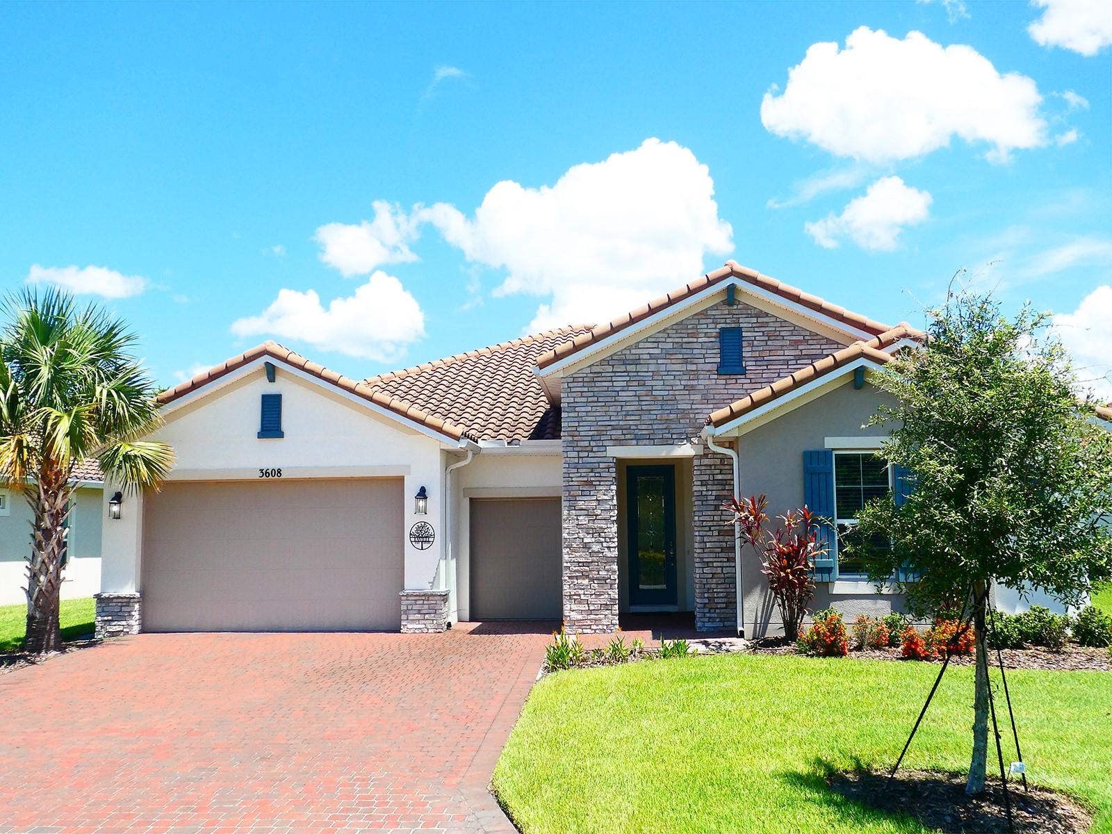 Presenting an opportunity to purchase a six-year young home in the Estates of Villaverla in Solivita, the Award Winning, Master Planned and Gated 55 Plus Golf Cart Community in Central Florida. Villaverla is the last phase of Solivita Estates/Grand Estates with only 38 homes and a prime location in the 4300+ acre community. Here the street ends in a cul-de-sac and continues a short distance with a walking path to the Stonegate Grille and Village Center, including the Rivera Fitness Center with outdoor pool, hot tubs, sauna, indoor lap pool, elevated air conditioned walking track and so many classes you will have a hard time choosing! This elegant home features amazing views that you can enjoy from the huge screened lanai which backs to water and surrounded by golf course. Hurry and take advantage on a great price on this amazing popular Siena floorplan featuring a tile roof and stone front, gourmet kitchen, large sitting room off the primary bedroom facing the beautiful waterview and make it your own! The upgrades are numerous but you will be dazzled by the stunning coffered ceiling with beams and crown moulding throughout great room, primary, sitting room and foyer; also cabinets and sink in laundry, gutters whole house, garage floor epoxy, ceiling fans on lanai. Even if you don’t golf on one of our two 18 hole PGA golf course, you can get a golf cart to use throughout Solivita visit your new friends, test your artistic abilities at art class or learn at Solivita University, shop at the sundries/pharmacy, tend your community garden box, join the softball or pickleball teams, the list goes on and on. There are two state of the art AMENITY centers with updated exercise equipment, yoga studio & meeting rooms, 3 restaurants, 14 HEATED POOLS, 17 PICKLEBALL courts, 9 TENNIS courts, 4 BOCCE BALL courts miles of bike paths, and 2 dog parks. The HOA maintains the landscaping and irrigation systems and your reclaimed water is include, provides SECURITY includes gate guards and mobile patrols and allows automated gate access for residents via license plate readers, and provides residents with Fiber Optic Internet & TV service. And if there is not enough for you inside the gates, just go across the street from the main entrance and you will find, along with the Hospital and medical offices, an all new shopping plaza with your favorites - TJMAXX, Ross, Five Below, Sprouts, Burlington, First Watch, Outback, Coldstone, and more to come! Come check out it out for yourself and don’t miss this beauty!