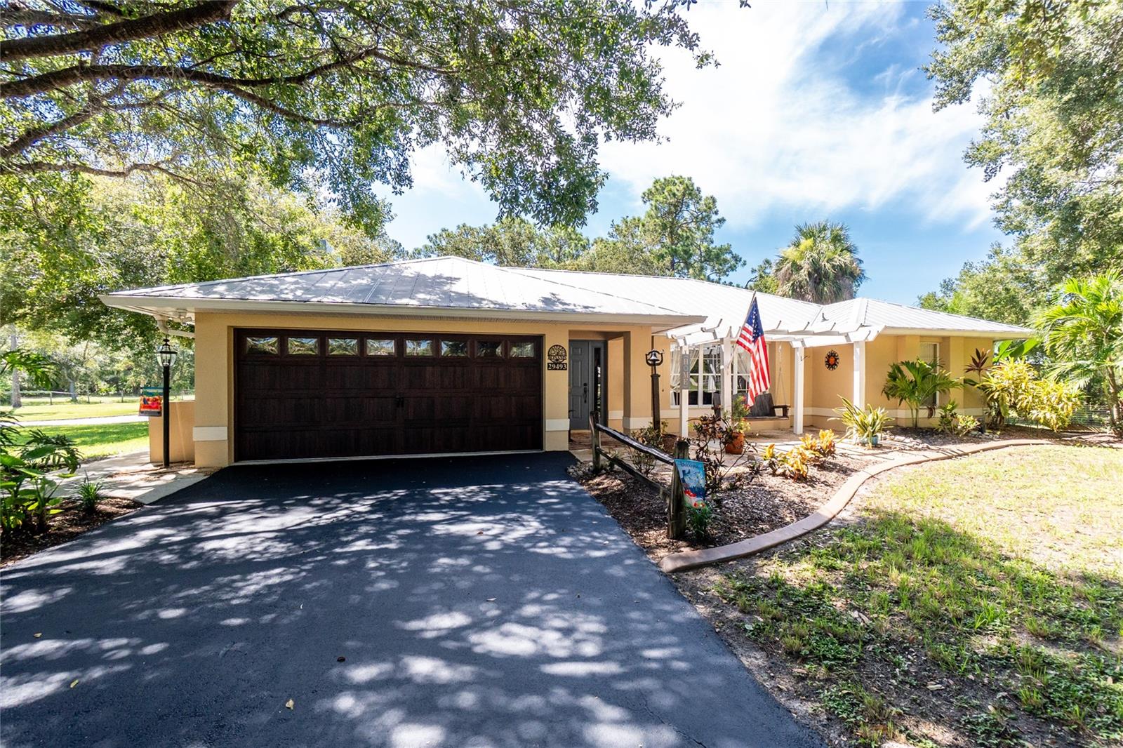 Welcome to your private slice of paradise in the heart of Punta Gorda! Nestled on a just over an acre, this beautifully maintained property offers the perfect blend of peaceful country living and functional design. Whether you're looking for room to spread out, space for your hobbies, or the ideal setup for storing your toys and tools, this home has it all. Step inside to discover a warm, inviting interior filled with natural light, with over 1,600sq ft of comfortable living areas, and a practical layout perfect for both relaxation and entertaining. But the real gem lies outside—a separate pole barn that’s every enthusiast’s dream. With ample room for boats, RVs, classic cars, or workshop equipment, it's the ultimate space for all your storage and recreational needs. NO HOA fees, not in a flood zone and zoned Agricultural, bring your chickens and goats! Enjoy wide-open skies, fresh air, and the charm of rural Florida living, all while being just a short drive from downtown Punta Gorda, shopping, dining, and waterfront fun. This is more than just a home—it's a lifestyle. See the attached feature sheet with all the latest upgrades (New refrigerator, RO System, and more!).