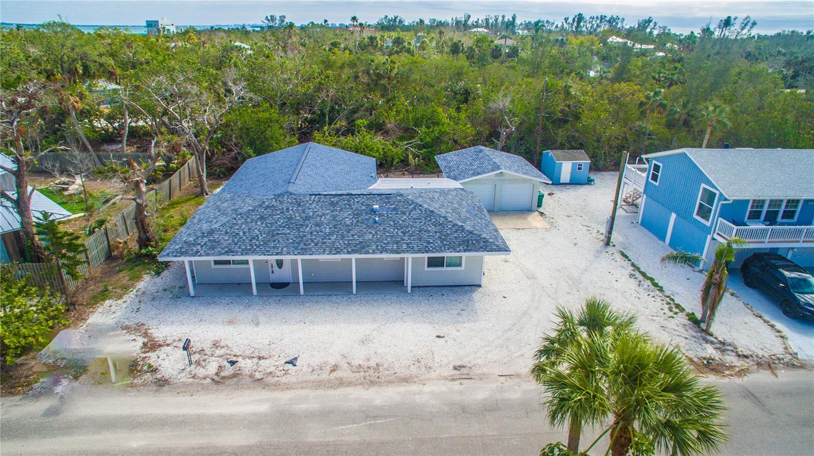 A TRUE FLORIDA DREAM HOME! WALKING DISTANCE TO ONE OF FLORIDA'S MOST BEAUTIFUL BEACH! This 4 bedroom, 3 bath and 2 car garage home is newly renovated thoughout. Step through the door into the spacious open kitchen and living area that expands into a back additional living area large enough for lounging and a pool table. 4 bedrooms and 3 bathrooms offers ample space for family and friends. The open backyard is great to relax and enjoy the Florida weather. The home is located close to wonderful dining and entertainment. The detached 2 car garage offers plenty of space for paddle boards, kayakes or a small boat storage.