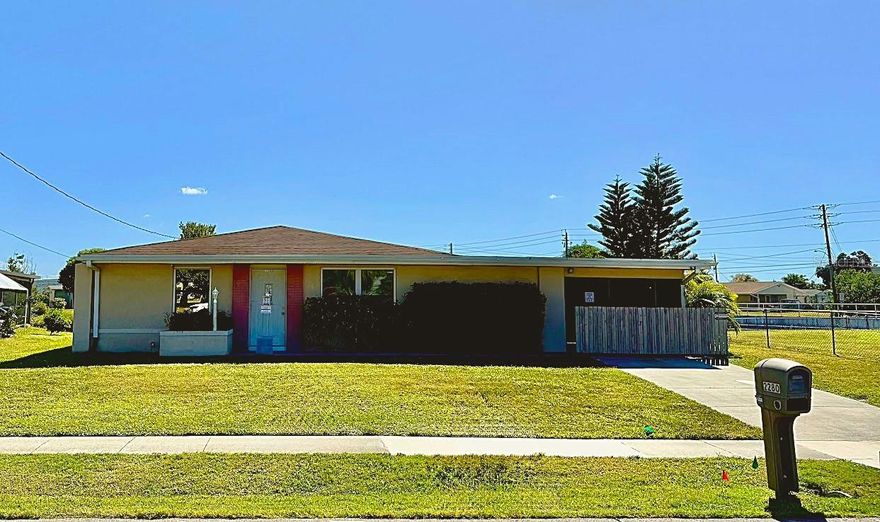 Perfect as a starter home, retirement retreat, or investment opportunity, this charming 2-bedroom, 1-bath waterfront home is centrally located in Port Charlotte on the Elkcam Waterway. Recent updates include a new A/C (2020) and a new water heater (2021) for added peace of mind. The kitchen features all-wood cabinetry, granite countertops, and Samsung SMART appliances that are less than a year old, plus a stackable washer and dryer. The primary bedroom offers an oversized walk-in closet with a stylish barn door, while the second bedroom is ideal for guests or a home office. The updated bathroom showcases shaker-style cabinetry and built-in storage. The open living and family room, complete with a large window to take in the pretty canal views, extends into the screened lanai, formerly a carport that has been converted into a flex area that also doubles as a workspace or hobby area, complete with a built-in workbench, and offers a fun bonus for kiddos with a large chalkboard for creative play. Step outside to enjoy peaceful freshwater canal views, a spacious backyard, and a recently added storage shed, with plenty of room to add a pool or design your own outdoor oasis. If you’re looking for a comfortable, versatile, and well-maintained home in Port Charlotte, this one truly stands out.