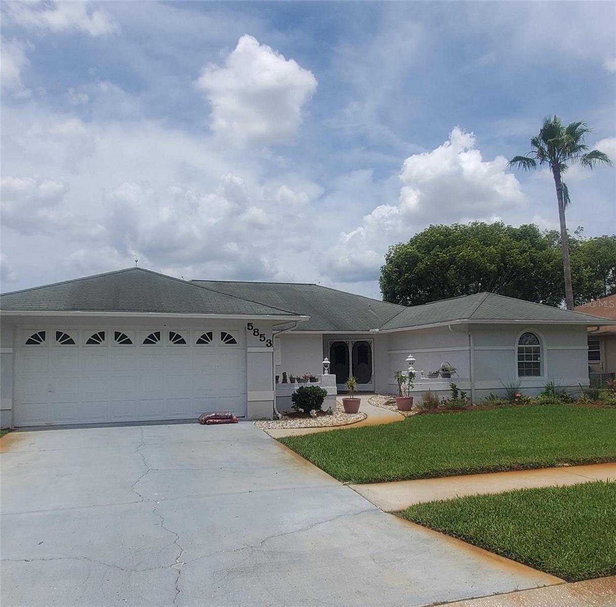 (Note Professional photos will be uploaded soon) Pool Home. Welcome to your spacious and open home situated in one of the most wanted area of Trinity and New Port Richey (River Crossing). This NON-Flood zone home Features a well appointed kitchen with access to the pool, Large Family room and Large living room with attached dining area, which leads out to the pool. This split bedroom features the main bedroom and bath separate from the additional bedrooms and bathroom.
The outdoor space is tailor-made for entertaining or relaxing in style by your pool and has a covered patio leading out to the pool. Centrally located within easy reach of top-rated schools, shopping centers, and delightful parks and minutes from the beaches, Tampa International Airport and Busch Gardens.. Plus, with major highways just around the corner, your daily commute or weekend adventures have easy access.