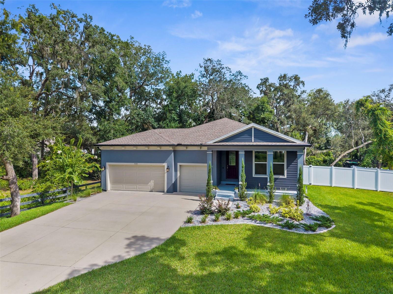 This stunning 4-bedroom, 2.5-bath, 3-car garage home, built in 2023, offers modern living at its finest with thoughtful upgrades throughout. Featuring a spacious 3-car garage with high ceilings for plenty of storage space and a large elevated yard to entertain in. The property also boasts a screened in back porch and large outdoor brick paver patio with retention wall around the base of the yard that adds a beautiful dimension to this outdoor space. Inside, you'll find a gourmet kitchen complete with sleek quartz countertops and premium finishes, flowing seamlessly into a large living room enhanced by eye-catching accent walls full of character. Luxury vinyl plank (LVP) flooring extends throughout the home, complemented by plush carpet in excellent condition in select areas. Ideally located in a desirable neighborhood just minutes from I-75, this home combines comfort, style, and convenience in one exceptional package. Also for sale is a .30 acre parcel directly behind the home that is only being offered to a buyer interested in purchasing this home! Call or text for more details about both!