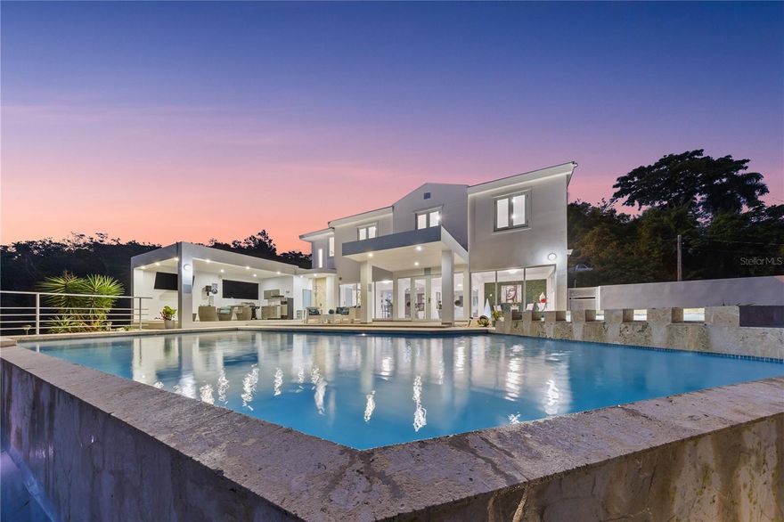 A Mountain Retreat with Endless Views and Income Potential — Caguas, Puerto Rico

Perched in the tranquil hills of Caguas, this stunning single-family retreat blends nature, comfort, and investment opportunity. The home offers panoramic mountain views and a dramatic infinity-edge pool that seamlessly meets the sky—an ideal backdrop for unforgettable sunsets or relaxed weekends.

Set on a spacious 1,212 m² lot, the property offers approximately 3,000 ft² of total construction, with 2,600 ft² of interior living space, thoughtfully distributed across 4 bedrooms and 3 full bathrooms. The home’s layout is designed for easy indoor-outdoor flow, with a generous covered terrace perfect for al fresco dining, entertaining, or simply taking in the scenery.

What sets this property apart is not just its beauty, but its performance. With a proven six-figure short-term rental history, this is a rare opportunity for both end-users and investors seeking a property that serves as both a sanctuary and a smart financial asset.

Whether you're looking for a full-time residence, a vacation home, or an income-producing asset, this home offers a lifestyle that feels far from ordinary—just minutes away from the heart of the metro.