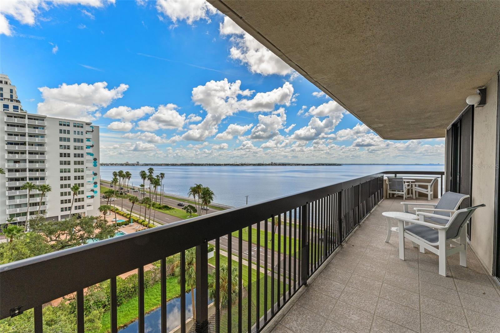 Welcome to The Atrium on Bayshore Blvd — and welcome to THE VIEW. Once you see it, you’ll never want to leave! This tastefully updated 8th-floor outside corner unit delivers panoramic water views, stunning sunsets over Tampa Bay, and a light, bright, and spacious layout that instantly feels like home.With over 1,500 sq.ft., this 2-bedroom, 2-bath condo has been thoughtfully updated with stylish flooring, modern lighting, and a newer HVAC — all the important upgrades are already done. The open layout is filled with natural light and features a huge wraparound balcony with amazing views of the bay. Whether you're sipping coffee in the morning or enjoying a glass of wine at sunset, this view never gets old.The living room is open and airy with two sets of sliders that lead right out to the balcony. The kitchen includes wood cabinetry, granite countertops, stainless steel appliances, an eat-in space perfect for a bistro set and another set of doors to the inviting balcony. The primary suite features another set of sliders that offer water views and lead to the balcony, a walk-in closet, and a sleek en-suite bath. The second bedroom is spacious and again offers access to the balconya and a large closet — making it ideal for guests, a home office, or both. The hallway bath is spacious as well as is the laundry closet with stacked washer/dryer and extra storage.And here's the best part: Milestone Study completed and ALL assessments have been paid! Just move in and enjoy the worry-free lifestyle. The Atrium offers incredible amenities, including:24/7 front desk security, Waterfront heated pool & spa, Fitness center, club room & library, On-site management, Pet-friendly community with dog park. The location is absolutely unbeatable. You're right on Bayshore Blvd with walkability to Howard Ave, Hyde Park, Downtown Tampa, top restaurants, cafes, shops, and nightlife. Jog, bike, or stroll along the bay just steps from your front door. Don’t miss this rare opportunity to own one of the most desirable condos in South Tampa. The view alone is worth it. Come see for yourself!