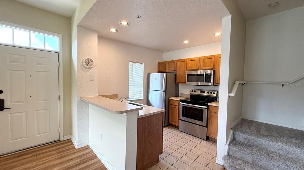 Photo of 2201 San Vittorino Circle #102, Kissimmee, FL 34741 (MLS # O6442172)