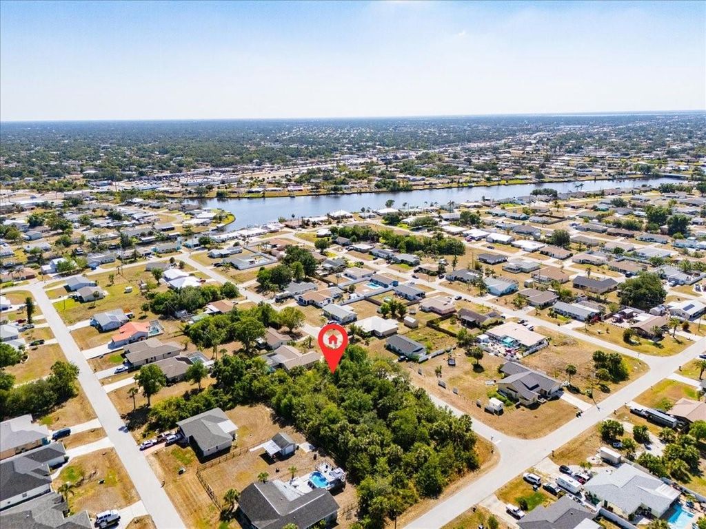 Photo of 868 Mensh Terrace NW, Port Charlotte, FL 33948 (MLS # C7509314)