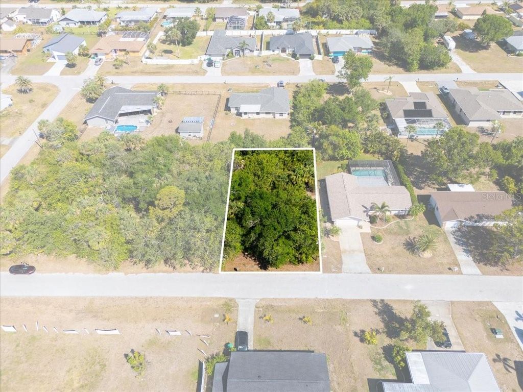 Photo of 868 Mensh Terrace NW, Port Charlotte, FL 33948 (MLS # C7509314)