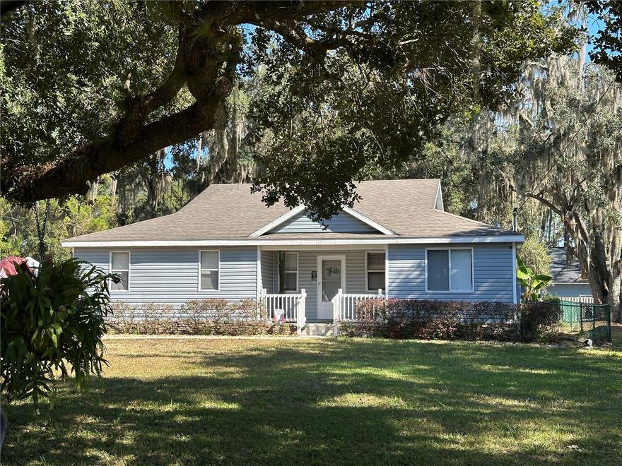 Beautifully maintained home located on a large corner lot with no HOA in the highly desirable New Eden on The Lakes neighborhood. Enjoy lake access to the Alligator Chain of Lakes, ideal for boating and fishing. The property features mature oak trees, a welcoming front porch, a side-entry garage, and a fully fenced yard. Interior offers an open floor plan with wood grain tile throughout the main living areas and wet spaces. Bedrooms are generously sized with carpeting. The kitchen has ample storage space, stainless steel appliances, and granite counters. The backyard provides ample space and includes a covered, screened-in patio, perfect for outdoor enjoyment. The home is move-in ready and shows pride of ownership throughout. Roof replaced in 2019. Shed and Spa are negotiable.*Photos coming on 23rd Dec.*