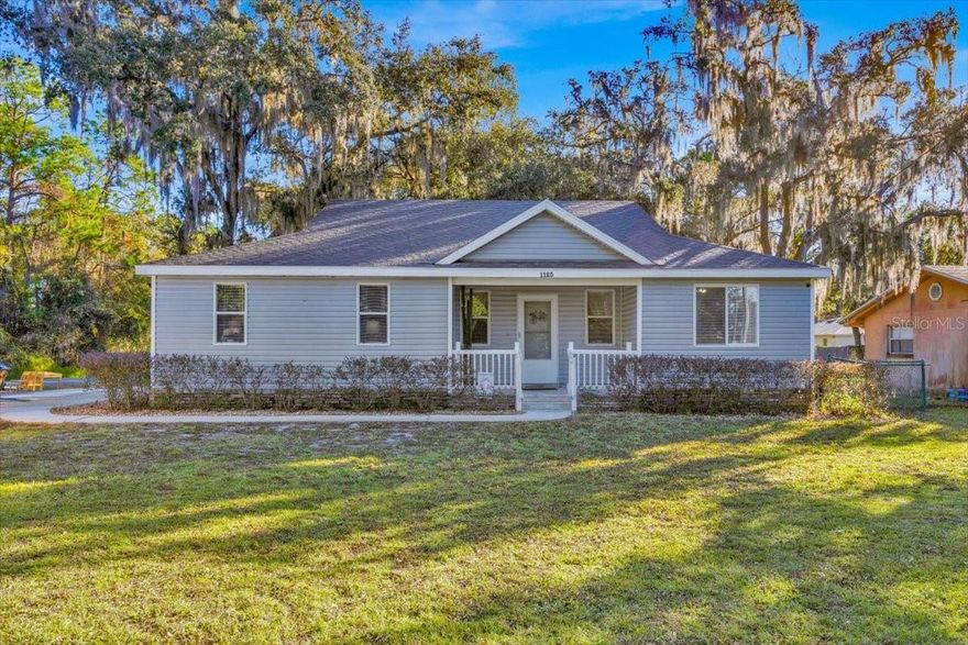 Beautifully maintained home located on a large corner lot with no HOA in the highly desirable New Eden on The Lakes neighborhood. Enjoy lake access to the Alligator Chain of Lakes, ideal for boating and fishing. The property features mature oak trees, a welcoming front porch, a side-entry garage, and a fully fenced yard. Interior offers an open floor plan with wood grain tile throughout the main living areas and wet spaces. Bedrooms are generously sized with carpeting. The primary suite features a spacious room, a walk-in closet, and an en suite bathroom with a standing shower and a dual vanity with quartz counters. The kitchen has ample storage space, stainless steel appliances, and granite counters. The backyard provides ample space and includes a covered, screened-in patio, perfect for outdoor enjoyment. The home is move-in ready and shows pride of ownership throughout. Roof replaced in 2019. Shed and Spa are negotiable.*Photos coming on 23rd Dec.*