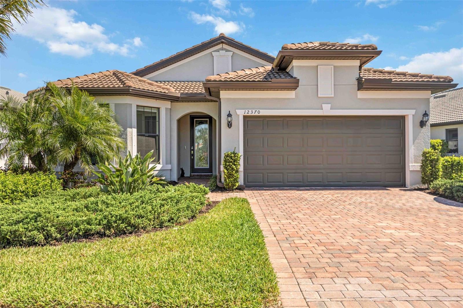 Welcome to your dream home in the desirable gated community of Hammock Preserve in Palmer Ranch. This exceptional 4-bedroom, 2-bathroom "Mystique" model by DiVosta Homes seamlessly blends luxury and comfort, offering an open-concept design perfect for modern living. Step inside to find crown molding and elegant tile flooring throughout the main living spaces. The primary suite features stylish laminate flooring and a tray ceiling for added sophistication. The primary bath is a serene retreat, complete with a walk-in shower, dual sinks with quartz countertops, and modern fixtures. Designed for seamless indoor-outdoor living, the corner slider opens to an extended covered lanai, where your private heated saltwater pool and spa await. The pool features extensive upgrades including a sun shelf with bubblers and multi-color LED lighting, creating a resort-like ambiance perfect for year-round relaxation. Additional highlights include a paver driveway, hurricane shutters, an epoxy-coated two-car garage with an EV charger, and maintenance-free living. Hammock Preserve offers a wealth of amenities, including a clubhouse, fitness center, tennis and pickleball courts, bocce ball courts, fire pit, outdoor BBQ grills and a resort-style pool and hot tub. Located just 6 miles from the world-renowned Siesta Key Beach and a short 20-minute drive to downtown Sarasota, this home places you at the heart of Florida’s finest coastal lifestyle. Don’t miss the opportunity to make this exquisite property your own! Furniture is negotiable on separate contract.