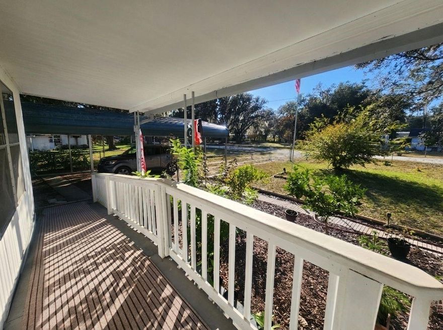 Not lot rent. No HOA. Central Air. Clean, updated, and move-in ready — this affordable home is truly better than most in this price range. Set on a fully fenced quarter-acre lot, the property features a beautifully landscaped front yard with mature oak trees and plenty of usable outdoor space. Enjoy a large two-car carport, a huge front patio, a screened back porch, and a wheelchair ramp for easy access. A new, clean 16x10 shed with A/C and its own front porch adds the perfect spot for storage, hobbies, or a small workshop. Inside, the home offers a bright, modern feel with a beautifully updated kitchen, complete with benches under the bar. The spacious laundry/utility room off the bedroom provides excellent extra storage and workspace. The home is clean, comfortable, and well maintained — a standout option for affordable living in Marion County.