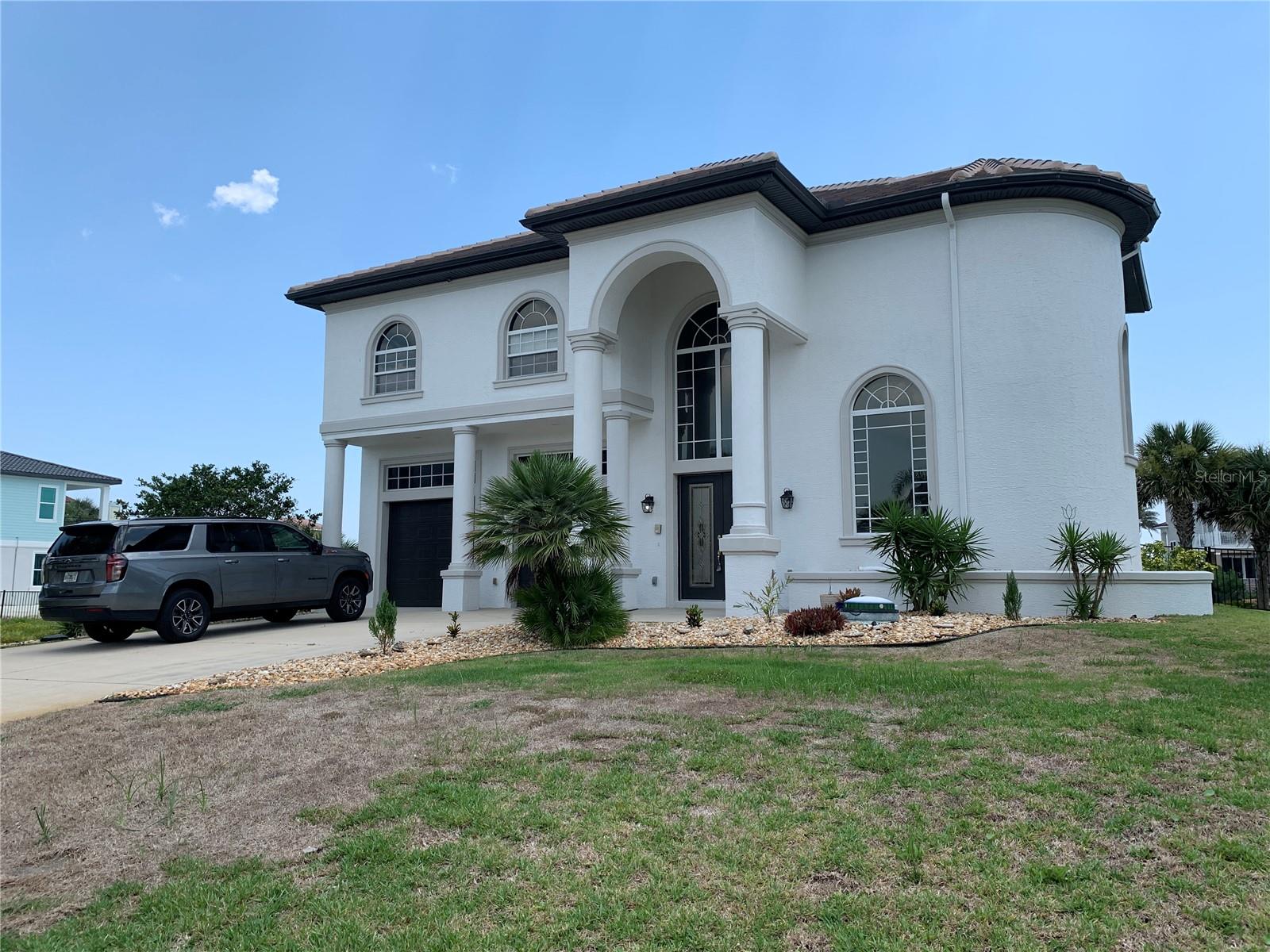 This is a beautiful home just steps to the intracoastal. There is a community pool for the neighborhood and the property is stunning. Very large and an entertainers dream with an upstairs balcony just letting in the breeze!
