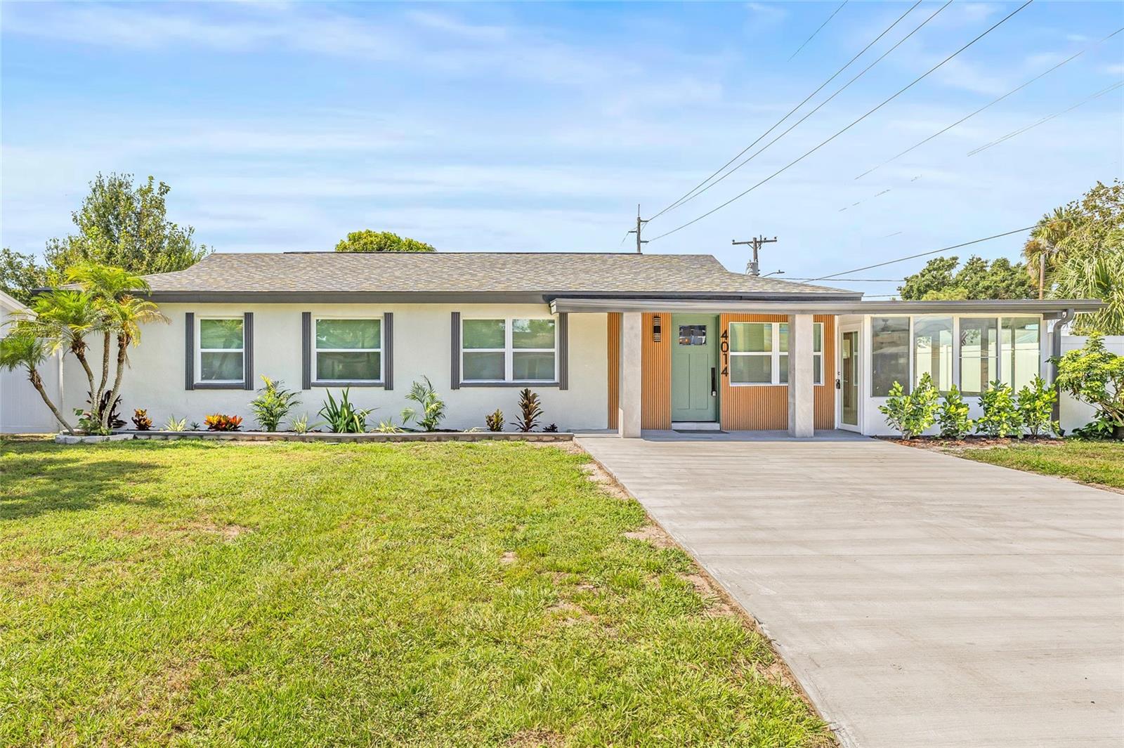 Nestled in one of South Tampa’s most sought-after neighborhoods, this impeccably renovated residence combines curb appeal, high-end finishes, and functional design to deliver the perfect blend of luxury and comfort. From the moment you arrive, the inviting front porch and manicured exterior set the tone for the beauty that awaits inside. Step through the front door into a bright, open floor plan featuring brand-new designer tile flooring and fresh, modern paint throughout. The spacious dining area flows effortlessly into a sunlit living room and a show-stopping kitchen that feels straight out of a design magazine. The kitchen is both stylish and functional, outfitted with all-new stainless steel appliances, soft-close cabinetry, sleek quartz countertops, ample storage, and a chic dry bar complete with a beverage fridge—ideal for entertaining in style. Tucked just off the main living area is a stunning Florida room filled with natural light. Whether you envision it as a home office, playroom, reading nook, or second lounge, it offers the perfect indoor-outdoor vibe with year-round comfort. The thoughtful layout features two luxurious primary suites, each with its own ensuite bathroom. The main suite, privately located at the rear of the home, offers a spacious walk-in closet with built-in organizers, a dual-sink vanity, and sliding glass doors that open directly to your backyard retreat. All bathrooms throughout the home feature high-end finishes, custom tile work, and a spa-like feel. The laundry room is equally impressive with custom cabinetry, a deep sink, and added storage for maximum convenience. Step outside to your newly screened-in porch—perfect for relaxing or entertaining—leading to a fully fenced, oversized backyard. Behind the gated driveway, you'll find a covered carport with room for your vehicle, boat, or weekend toys, plus a large storage shed for all your extras. Located minutes from everything—10 minutes to Downtown Tampa, Hyde Park Village, Bayshore, and just a short drive across the bridge to vibrant St. Petersburg. Surrounded by Tampa’s top dining, shopping, and entertainment, this home truly offers the best of South Tampa living. Don’t miss your chance to own this one-of-a-kind home that checks every box. Schedule your private tour today.