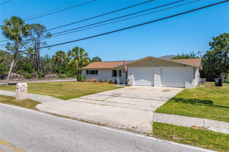 This charming 2-bedroom, 2-bath home features a spacious 2-car garage and a lovely Florida room with stunning water views. Situated on nearly half an acre, this property includes both the home and a large adjoining lot, offering plenty of room to build a pool, add fencing, or create your own private oasis. Enjoy direct water access right from your backyard! Launch a canoe or small johnboat and travel under a quaint bridge that leads straight into the Gulf. Located on a quiet dead-end street with no through traffic, this home sits in a well-established and peaceful neighborhood close to shopping, beaches, and great restaurants. Recent updates include all-new appliances, a brand-new A/C unit, and new kitchen cabinets.